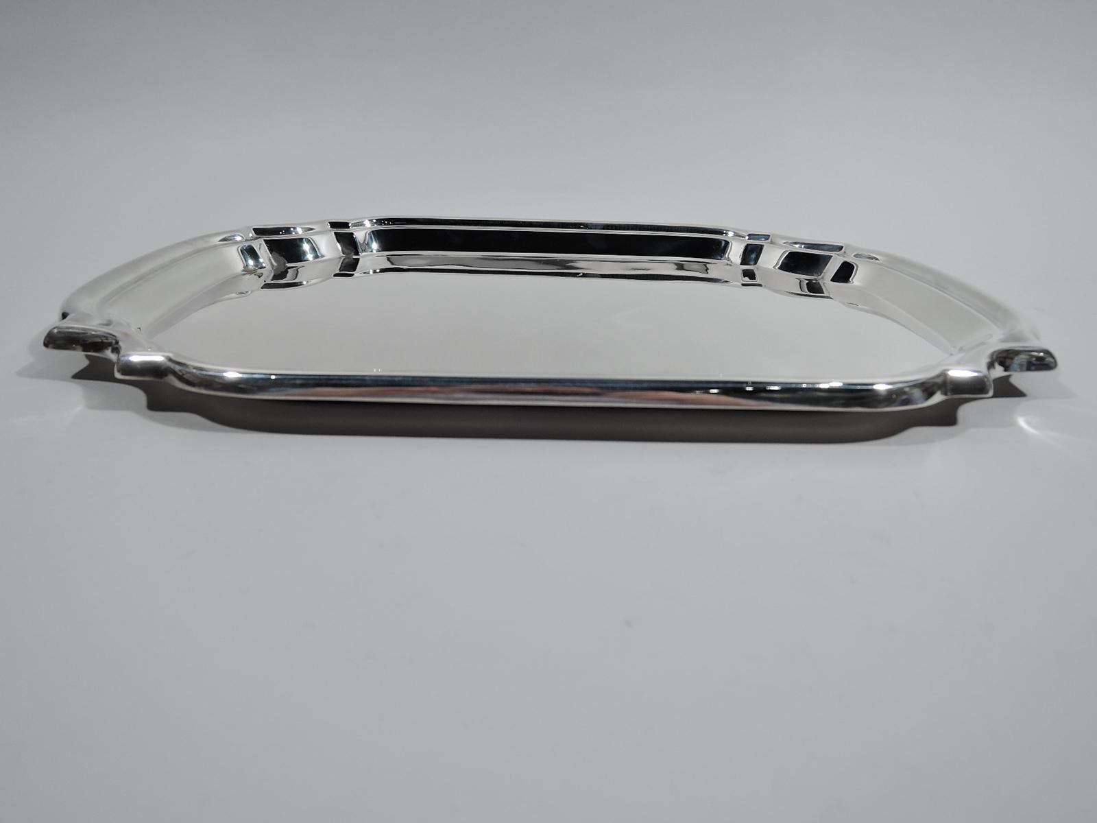 Georgian-inspired sterling silver tray. Made by Poole in Taunton, Mass. Rectangular cartouche with curved sides and curvilinear corners. A great party platter. Marked “Sterling by Poole / 372”. Weight: 30 troy ounces.