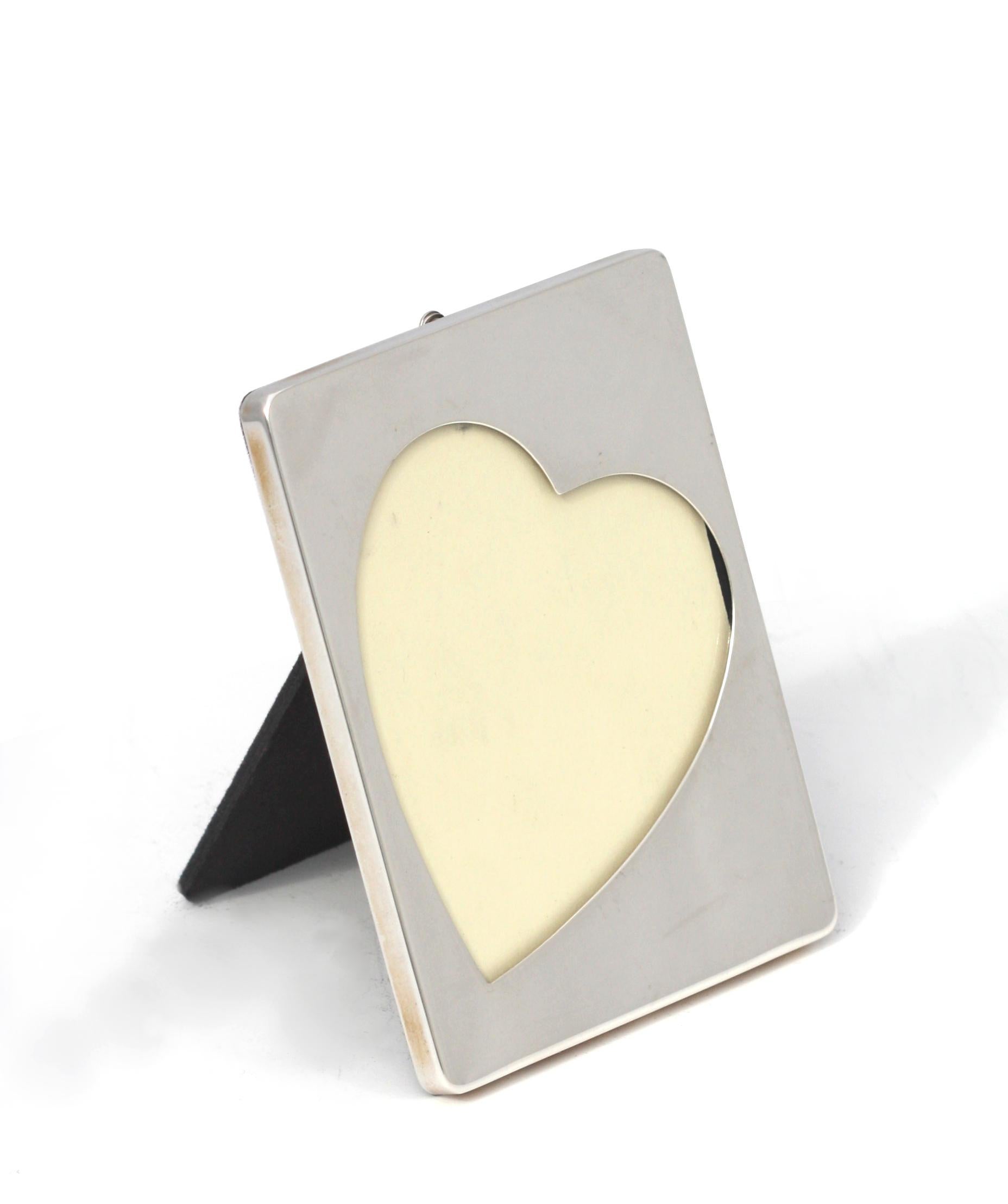 
American Sterling Silver Picture Frame
Marked Sterling, and with a C and a scepter.Rectangular, with a heart-shaped opening.
4 by 3 in., .73 troy ozs.