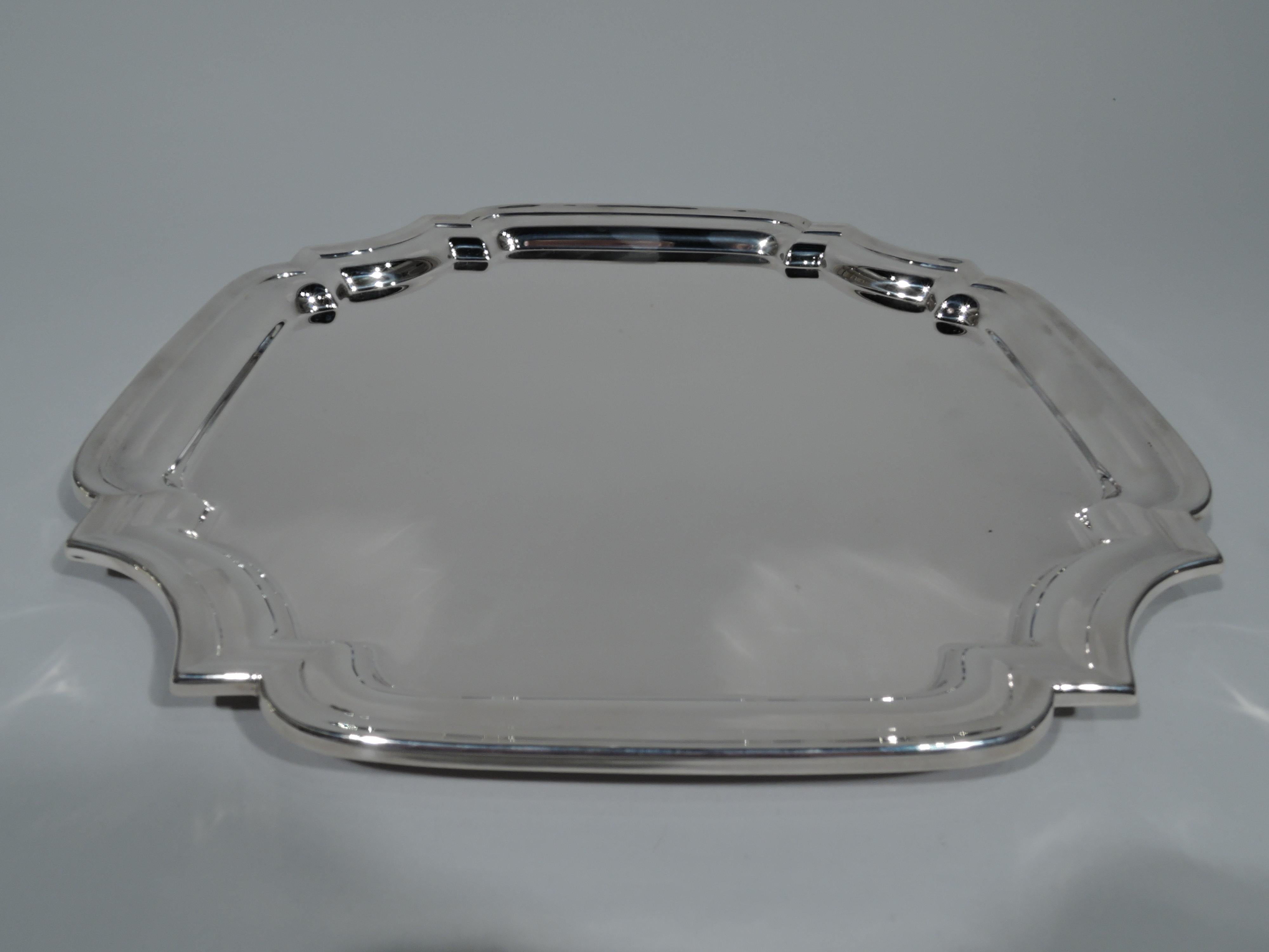 Georgian style sterling silver tray. Made by Lunt in Greenfield, Mass. Four curved sides and curvilinear concave corners. Molded rim. A nice traditional serving piece. Fully marked including no. S4S. Weight: 23.5 troy ounces.