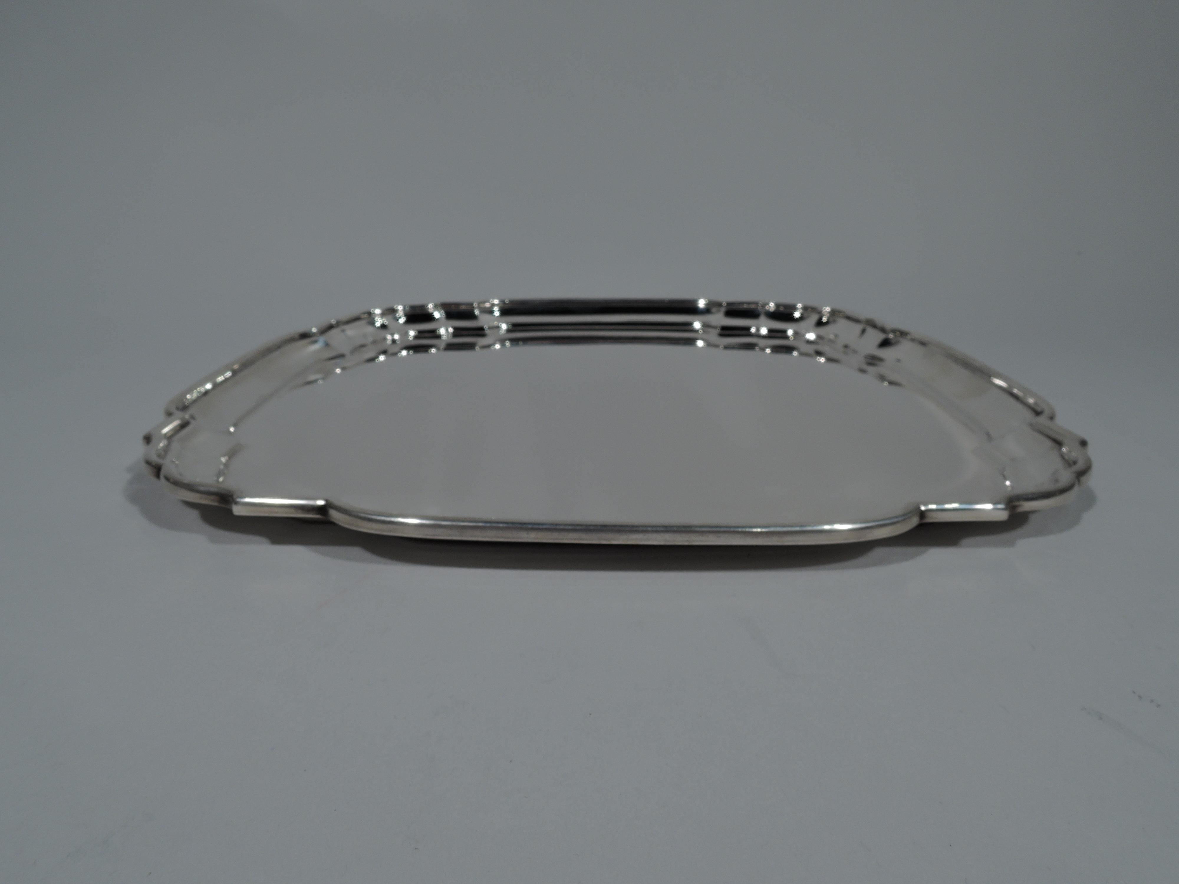 Georgian-style sterling silver tray. Made by Graff, Washbourne & Dunn in New York, circa 1920. Squarish with four curved sides, curvilinear corners, and molded rim. Fully marked and numbered 4611A. Weight: 23.5 troy ounces.