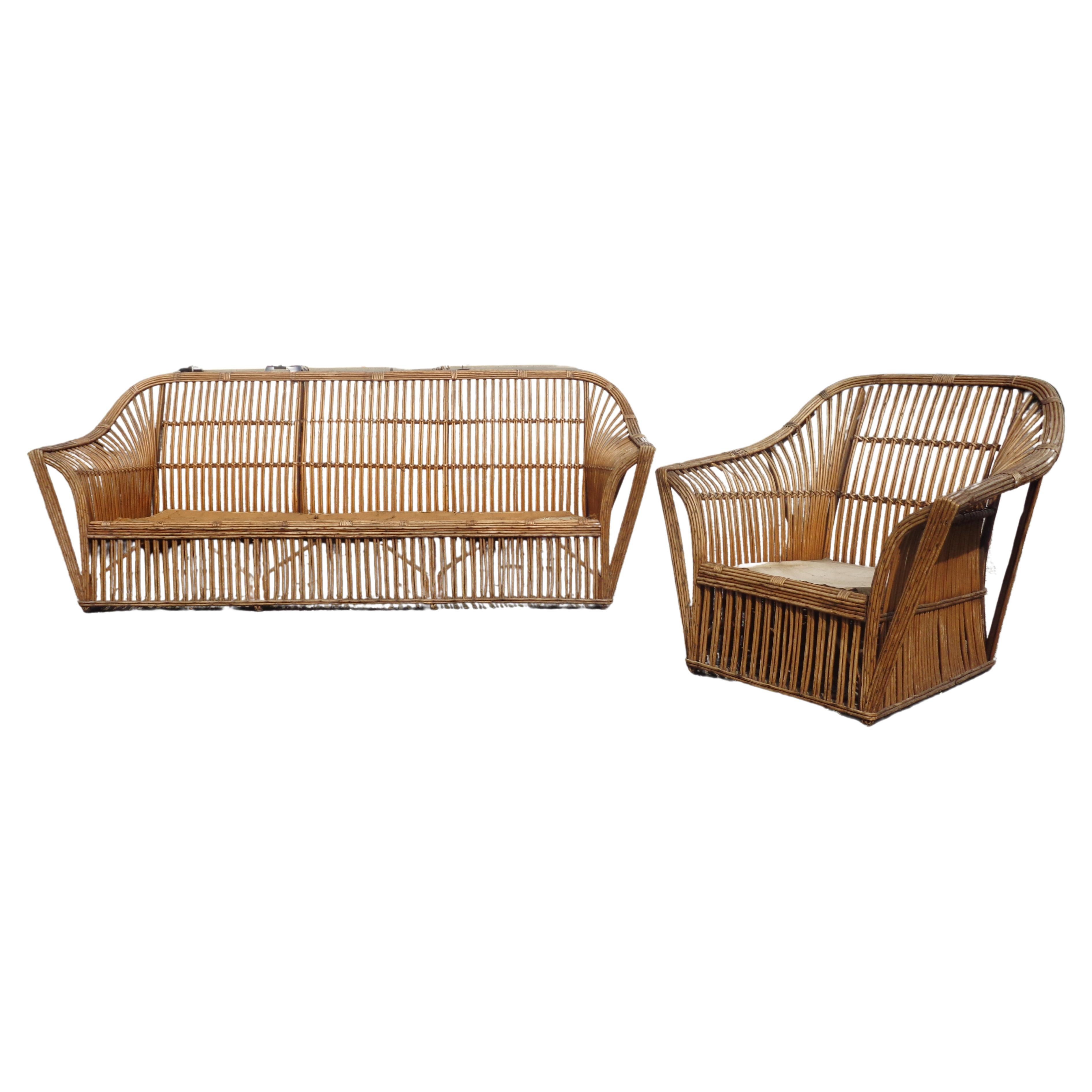 American two piece stick wicker set - sofa and matching lounge armchair in nicely aged old natural color finish. Very good quality solid heavyweight construction. Circa 1930. Substantial size. Sofa measures 86