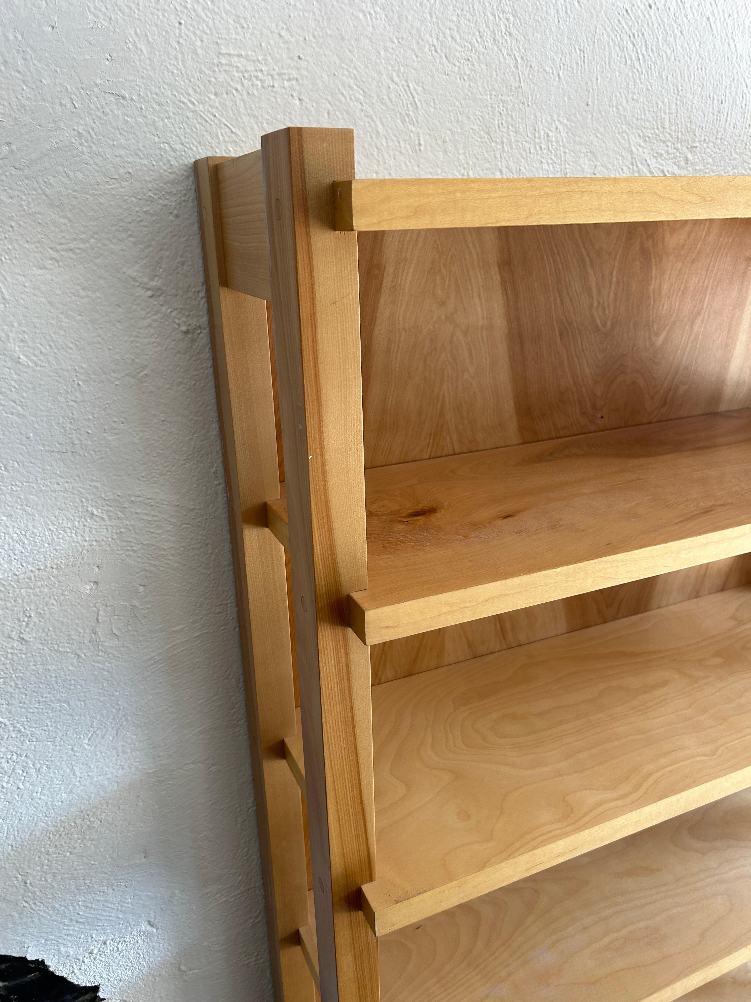 Mid century custom made blonde birch wood shelf wall unit or open bookcase. Very modern design and well built. Made of solid birch uprights and birch veneer plywood shelves. Very solid bookcase all 1 unit - no shelves adjust. Custom made in USA.