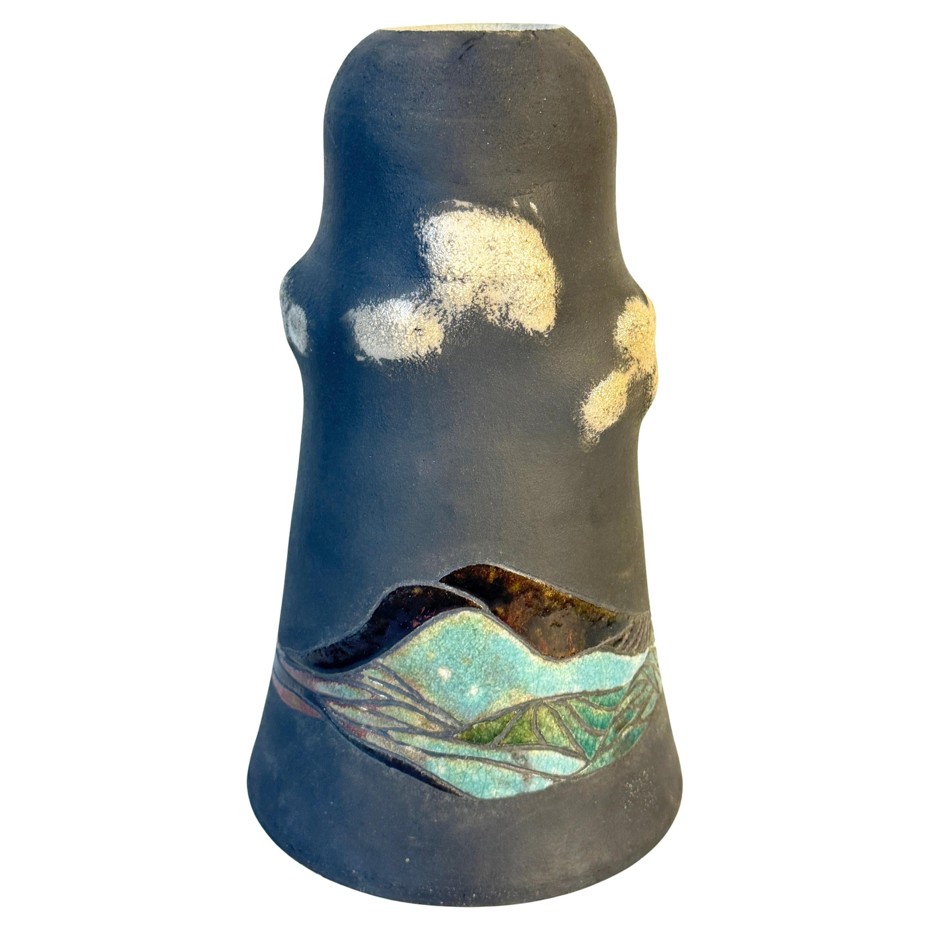 American studio ceramic vase, late 20th century (probably 1980s based on other pieces acquired in the group), signed indistinctly to base. Beautiful form, of rough unglazed black-ish finish, decorated with a border of textured clouds above an