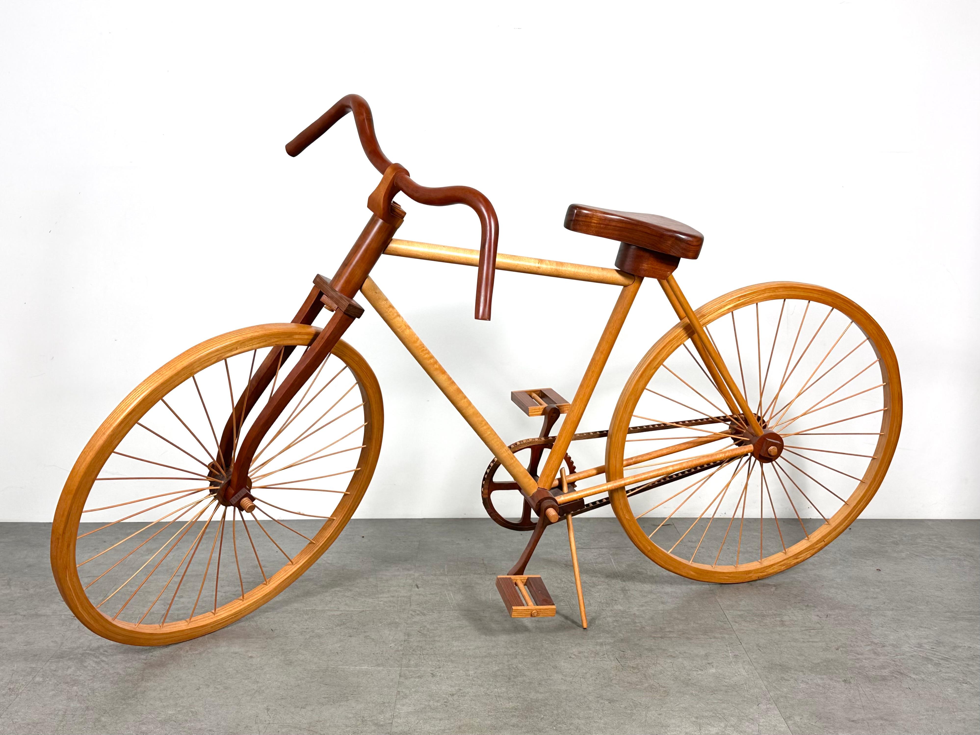 Incredible life size American Studio Craft artist made bicycle sculpture by Tiffany Hopkinson 1988

Mixed wood construction with amazing detail and functionality
All components including the gears and chain are hand crafted and assembled with no