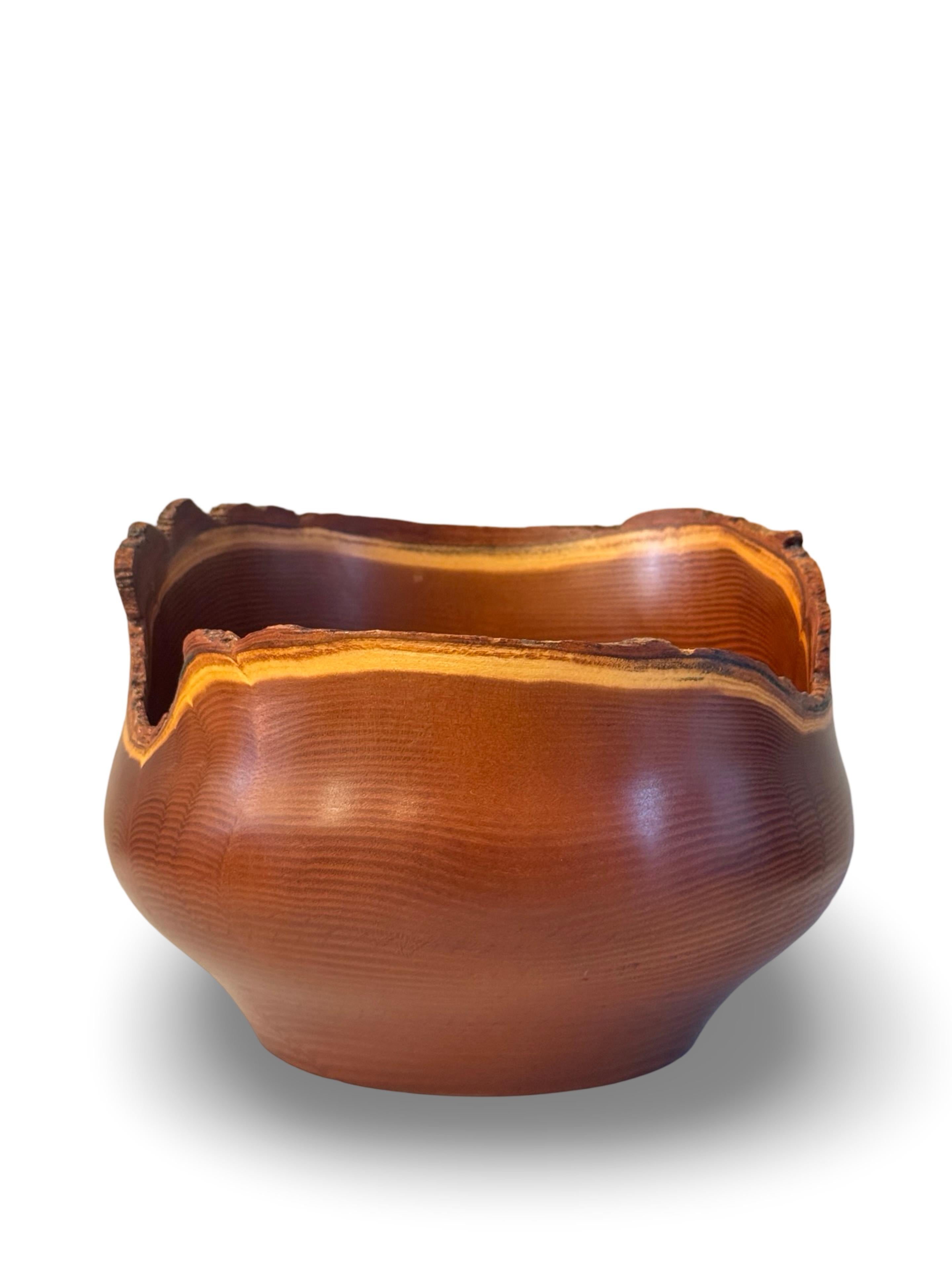 American Studio Craft Live Edge Wood Bowl, finely crafted in Osage Orange wood, signed and numbered by Pierre Frey. This bowl has a beautiful figuration and color, and an elegant sculptural quality. At just over 9 inches in diameter the bowl has a