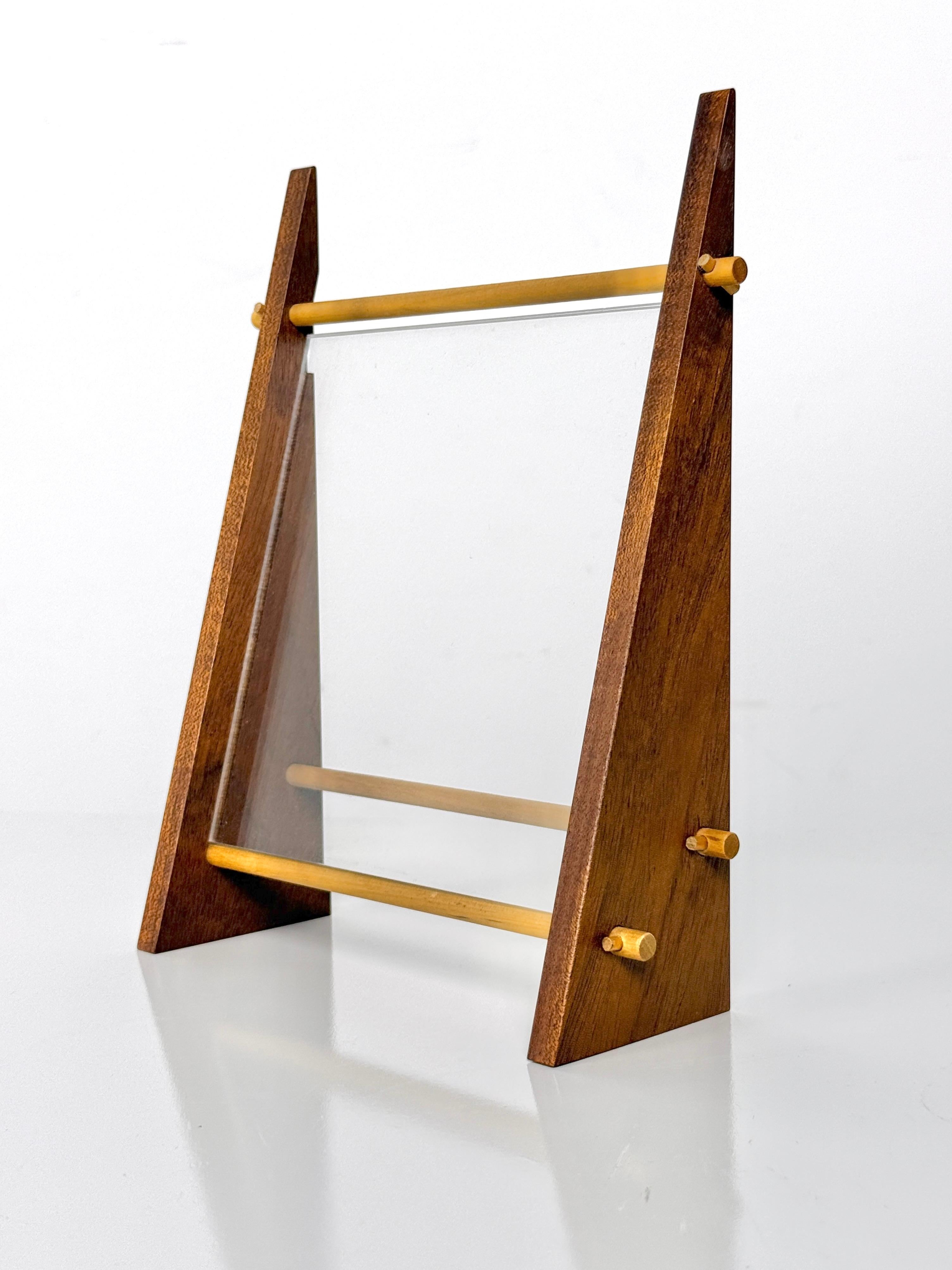 Unique hand crafted photo frame 
USA circa 1980's

A-frame design in dowel and peg construction with suspended acrylic panels 

A nice compliment to any modern space with Japanese or Scandinavian influence 

7.25 inch width
2.5 inch depth
9 inch