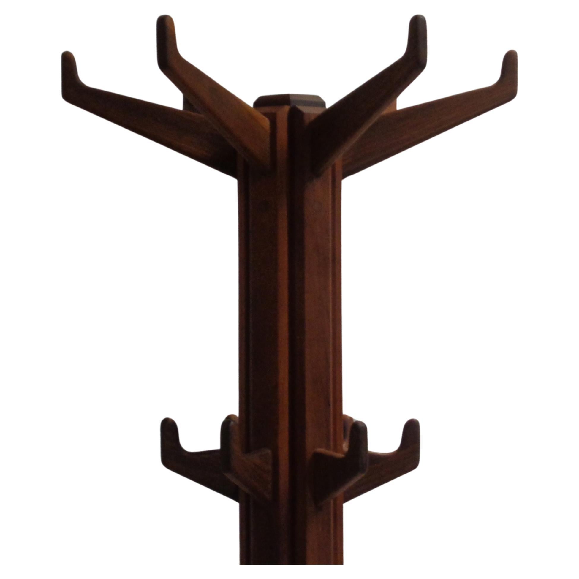 American studio craft movement cherry wood coat tree w/ hand carved and pegged joinery construction. Two levels of beautifully crafted hooks ( six at top and six below ) for coats, hats, scarves. Elongated six legged carved wood base that mirrors