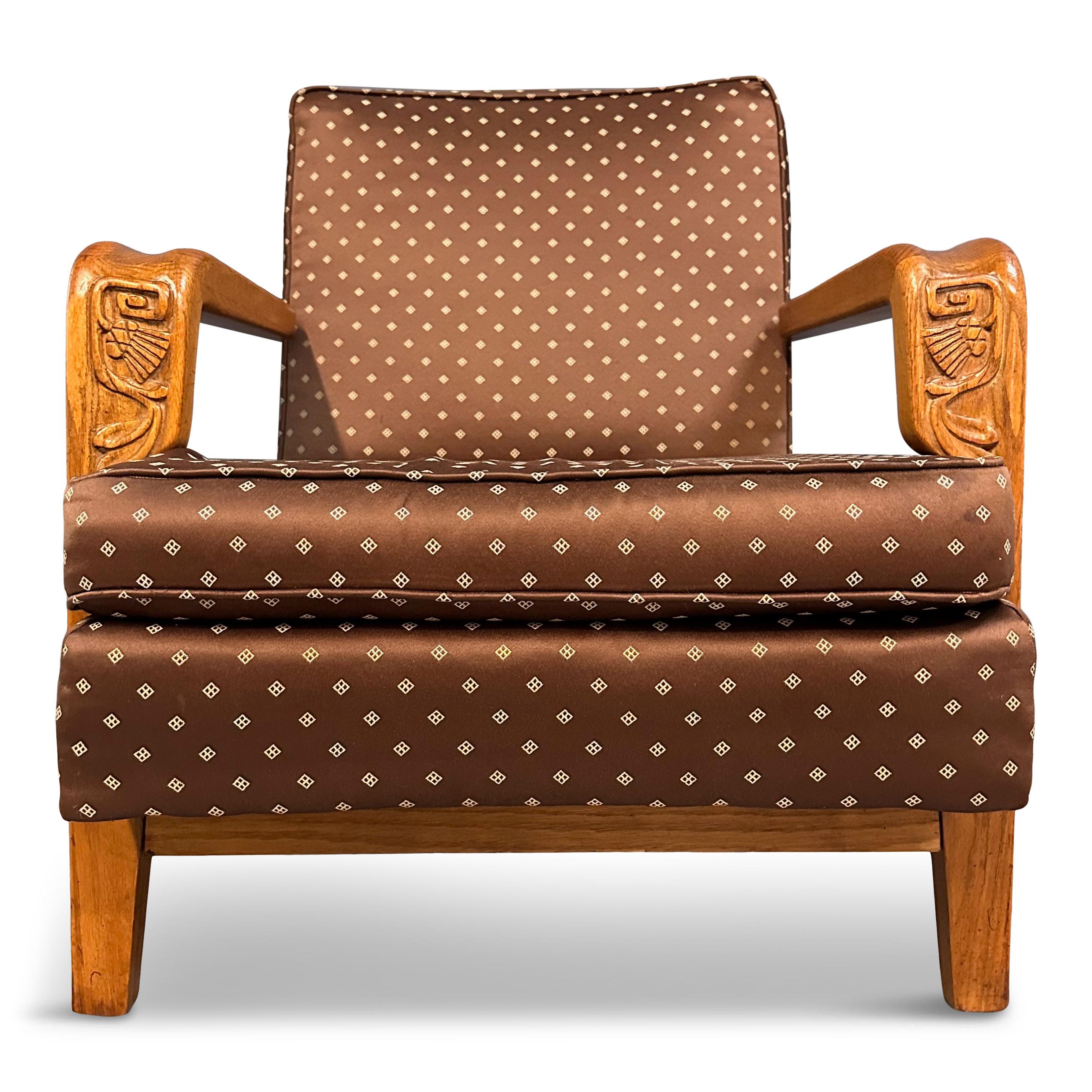 Indulge in the timeless elegance of our British Oak Lounge Chair by Jamestown Lounge Co. Crafted with exquisite thistle carvings and embodying mid-century design can you picture this chair upholstered in a rich wool, adorning any living space in