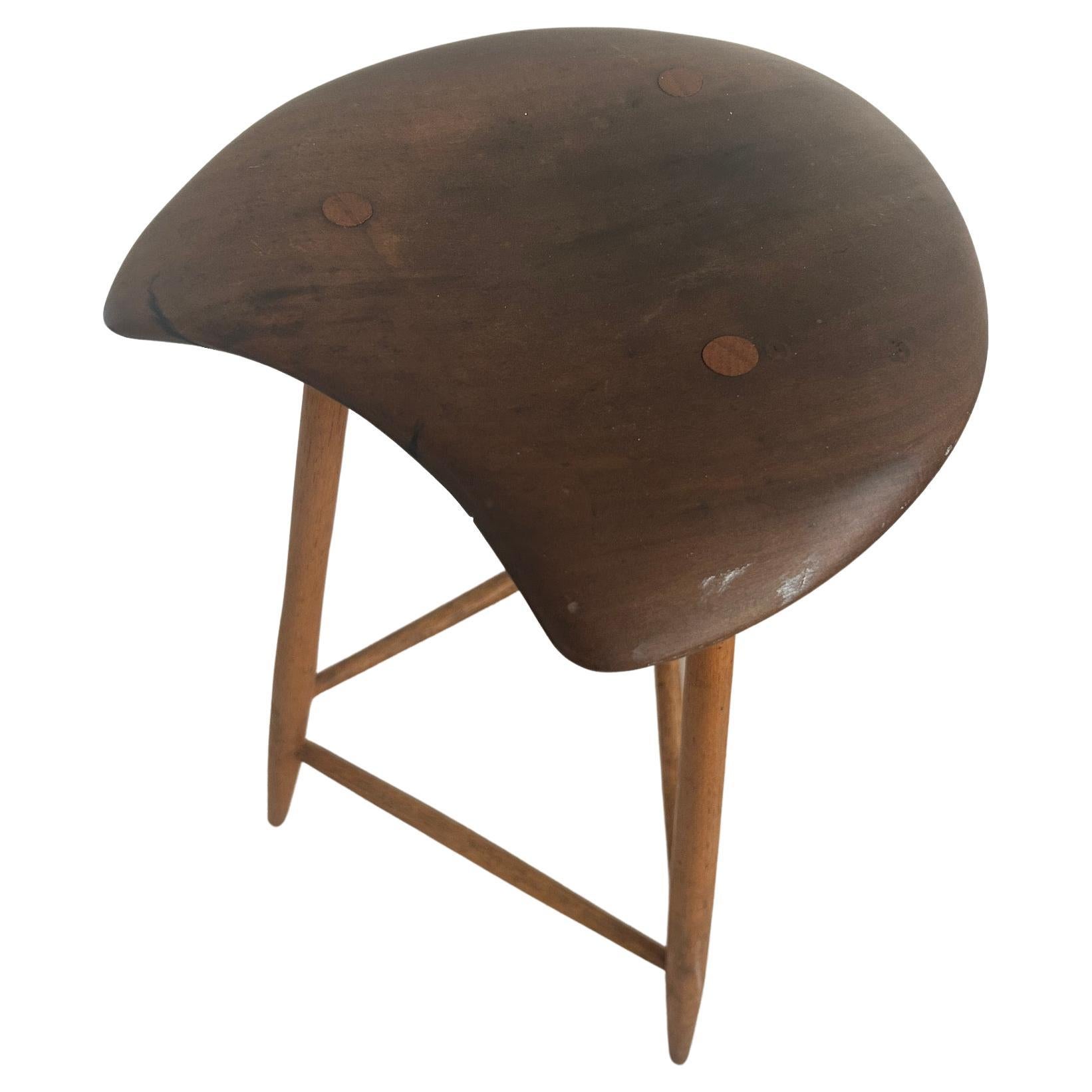 American Studio Craft Organic woodwork stool by Wharton Esherick student - Woodworker - Horace B. Hartshaw. Has a freeform seat supported by three splayed legs and signed on underside HBH 1981. Made in PA USA. Shows normal signs of use from age -