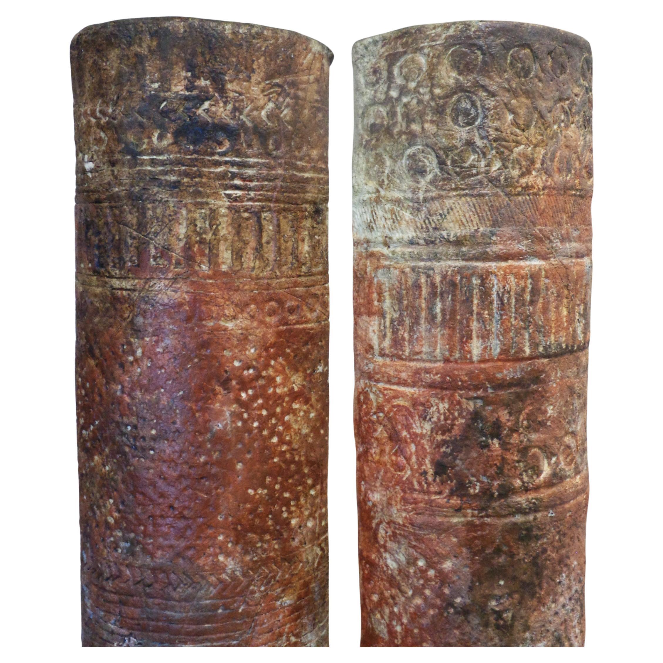 Pair of American Studio craft movement free standing half round pilaster columns w/ ancient burnished terracotta appearance and cryptic symbol decoration. Columns were constructed from a paper mache type emulsion of natural fibrous plant matter /
