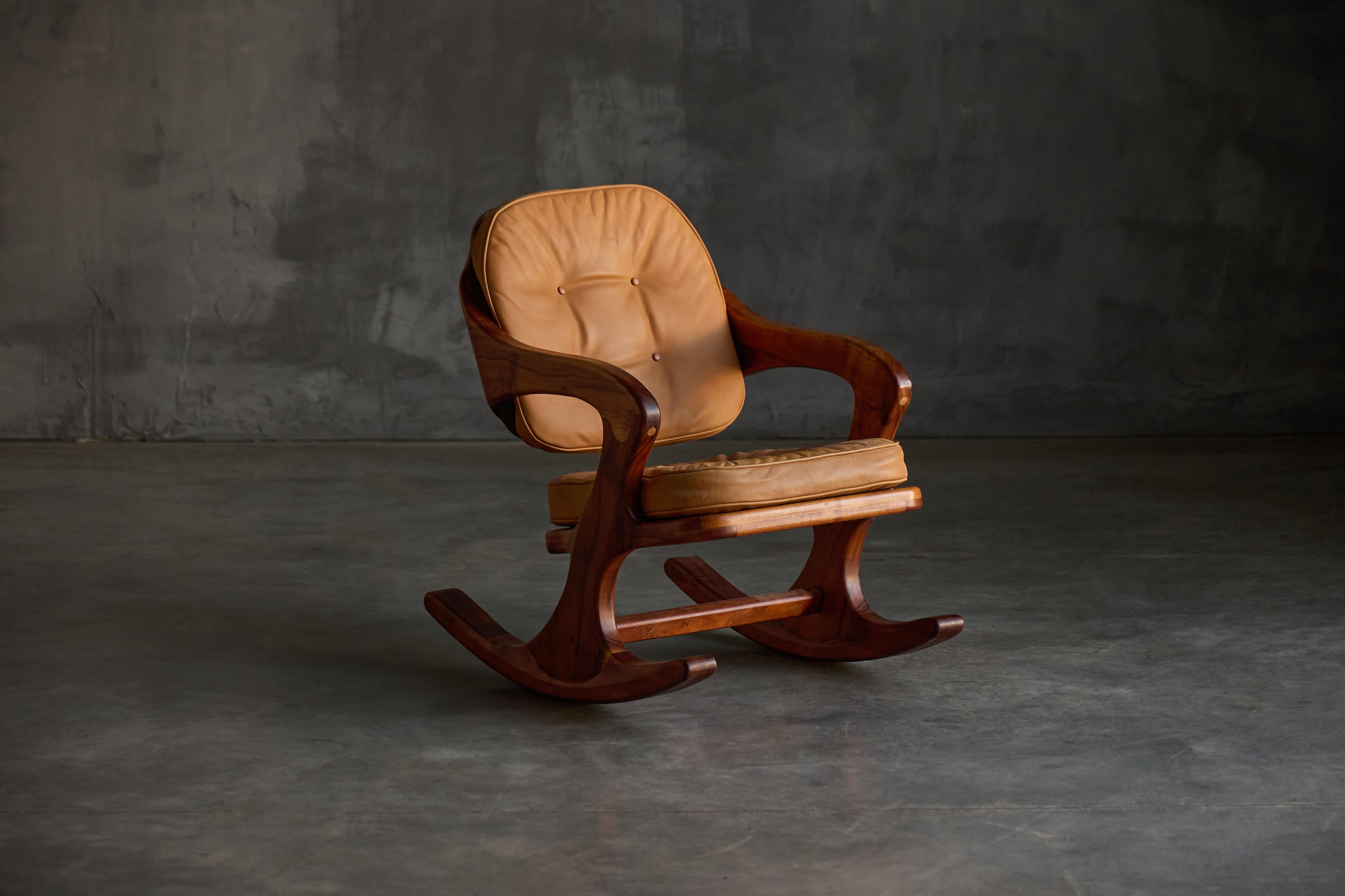 This 1970s American Studio Furniture chair exemplifies the essence of studio craft, a movement defined by the creation of bespoke, one-of-a-kind, or limited production furniture pieces crafted in a studio setting rather than mass-produced in