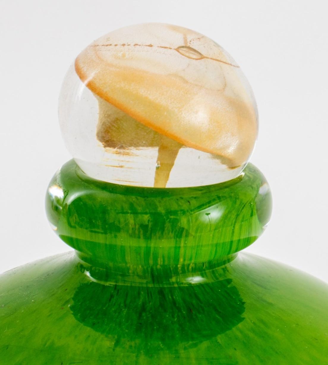 American studio hand blown glass bottle with stopper, signed to underside, circa 2003.

Dimensions: 7.25