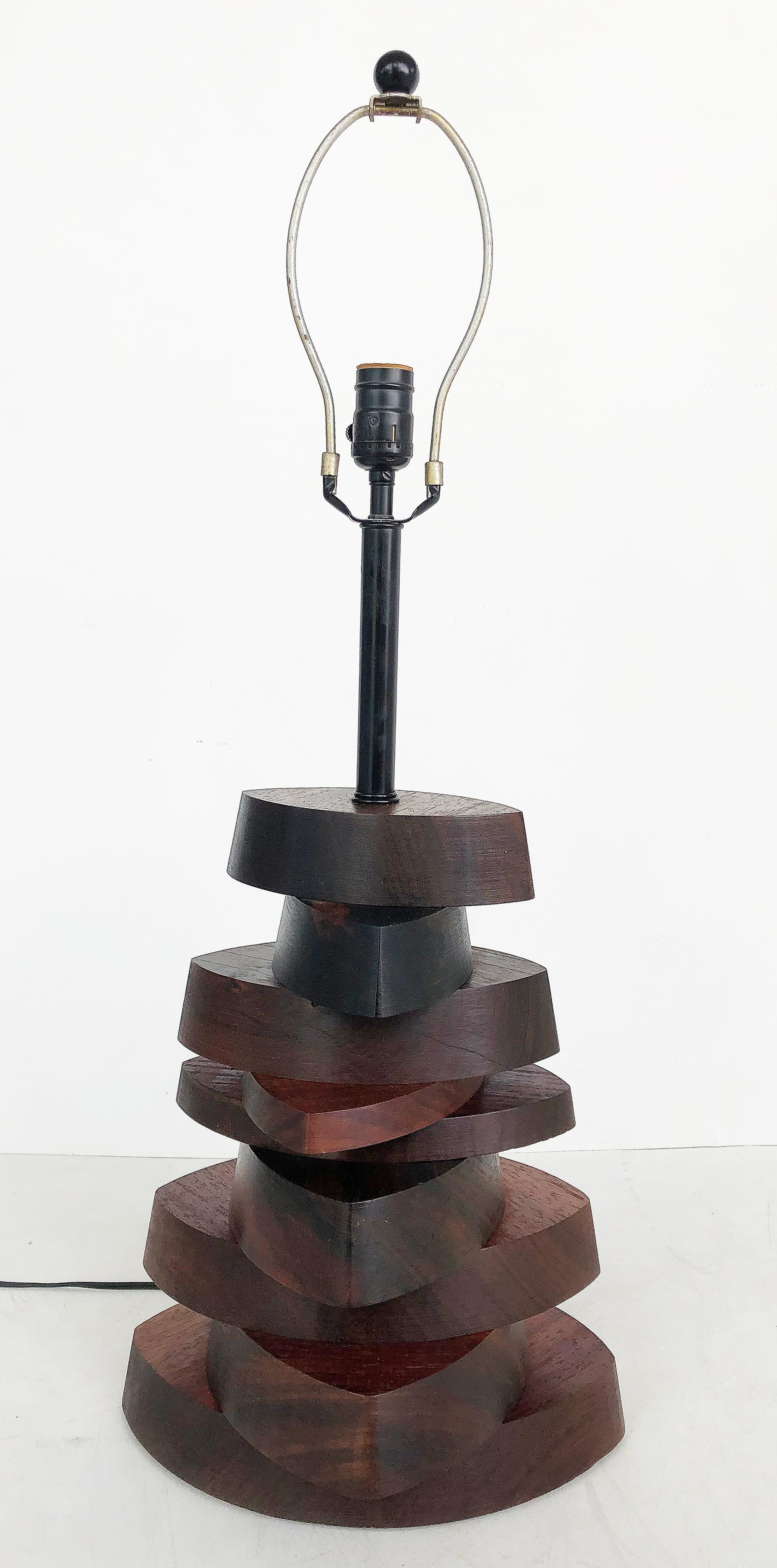 American Studio mechanical wood specimen table lamp, Mid-Late 20th Century

Offered for sale is an American Studio mechanical wood specimen table lamp with chunky sections of varied wooden specimens stacked a top one another. Crafted with a wooden