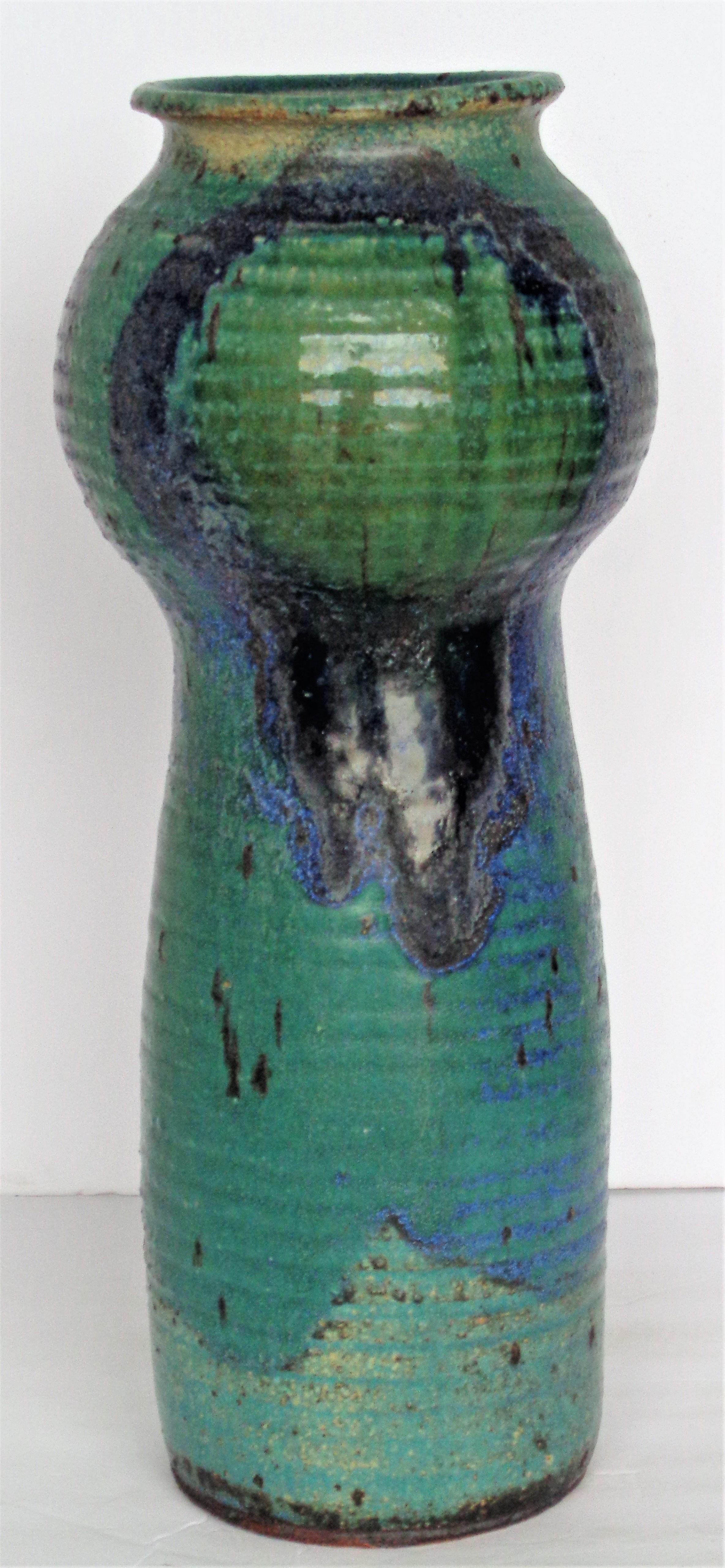 American studio craft art pottery tall sculptural vase with incredibly beautiful variegated blue green glazed textural surface by widely exhibited artist, potter - John P. Loree ( b 2031 - MFA Alfred University, Eastern Michigan University, Educator