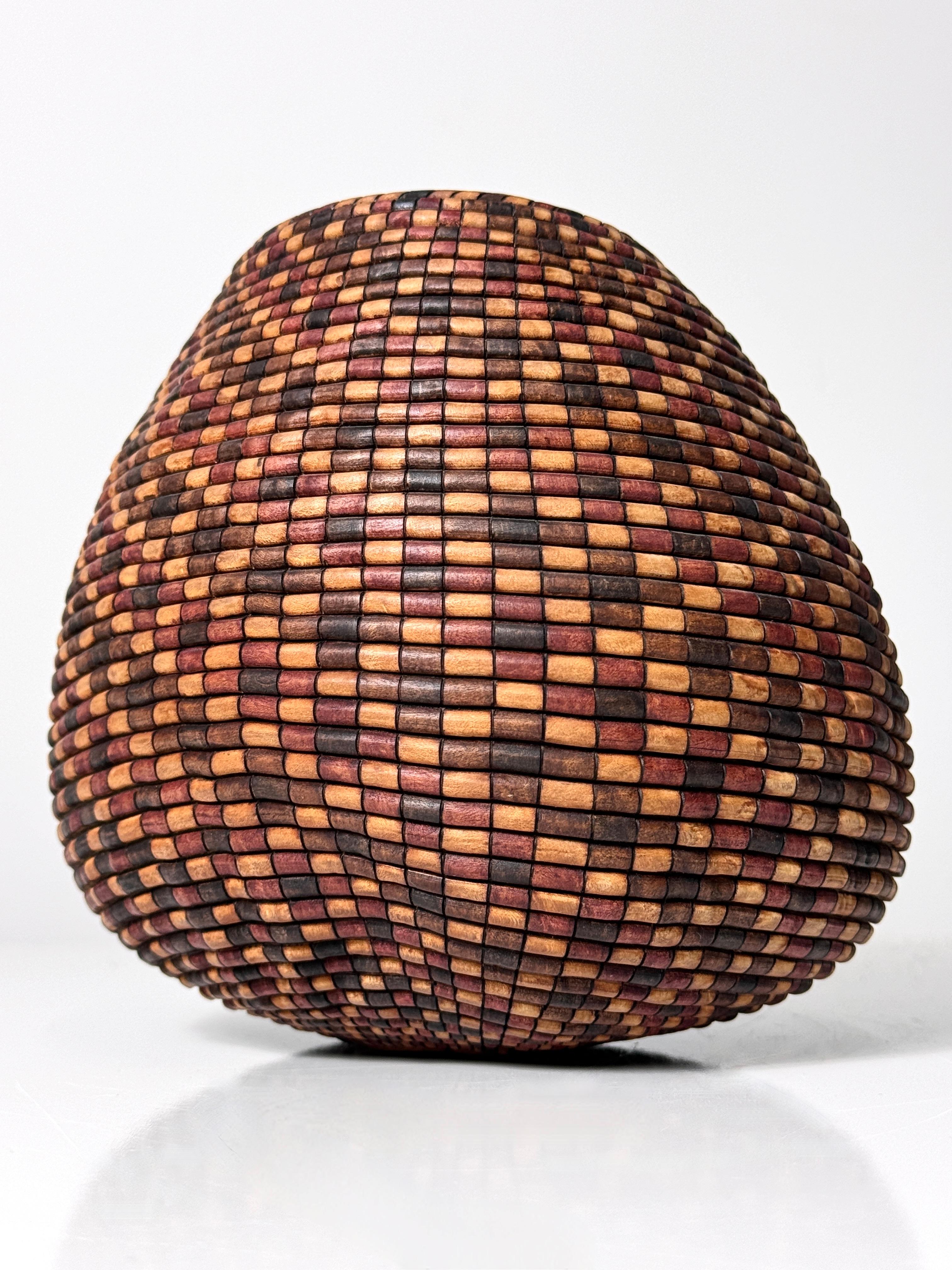 Turned wood vessel by American craftsman David Nittmann circa 1990s
Titled Black Lace of the Basket Illusion Series

Incredible piece in turned Madrone is burned and dyed to resemble the appearance of a basket
Signed and titled to underside

7 inch