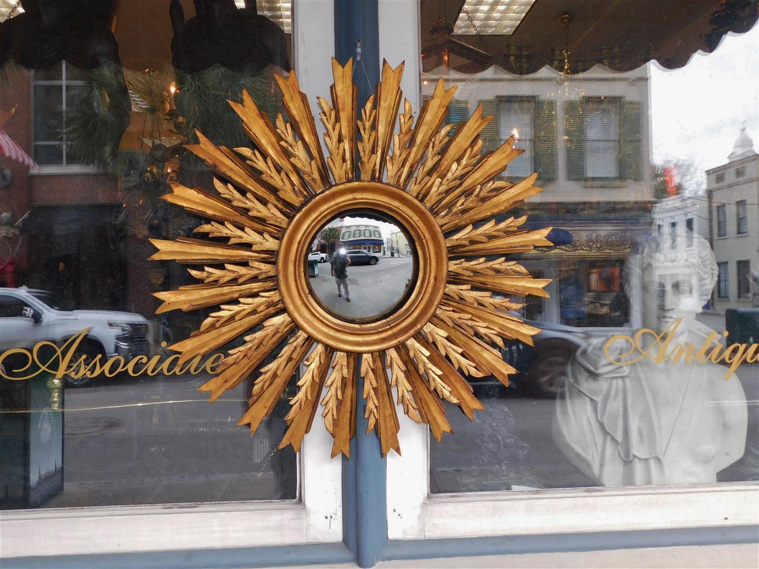American Sunburst gilt carved wood and gesso bullseye wall mirror with interior molded edge border. Mirror retains the original convex glass and backing. Late 19th Century. Interior mirror diameter is 9.25 inches.