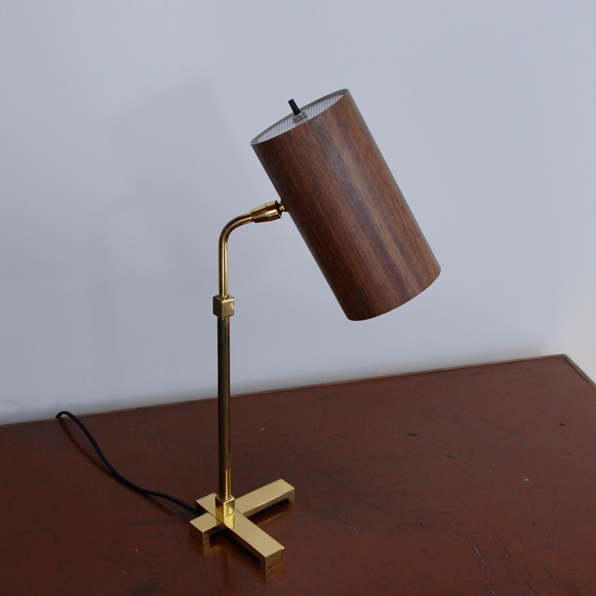 American 1950s of the period brass and aluminum table lamp. Rewired with single E26 medium based socket. Currently wired for use in the US. Light bulb included in order.
Measurements:
Height 18”
Shade 4” x 7.5”
Base 5.5”.
               
