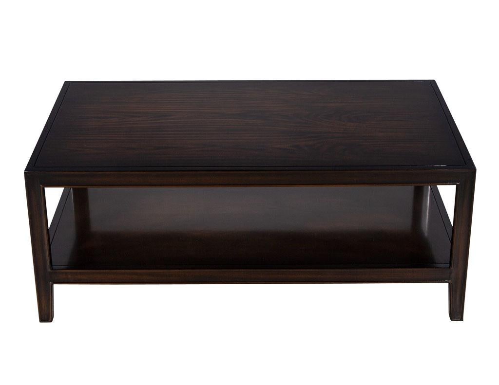 American Transitional Mahogany Coffee Table. Artistically finished and highlighted to accent the rich mahogany wood grains in a dark espresso brown finish. Simplistic rectangular design with open storage compartment, perfect for coffee table books