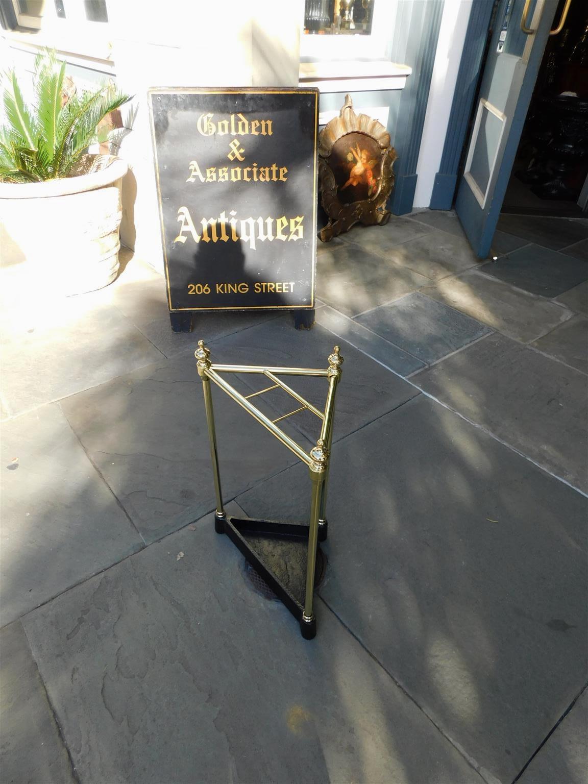 Cast American Triangular Brass & Iron Urn Finial Four Slotted Umbrella Stand, C. 1880 For Sale
