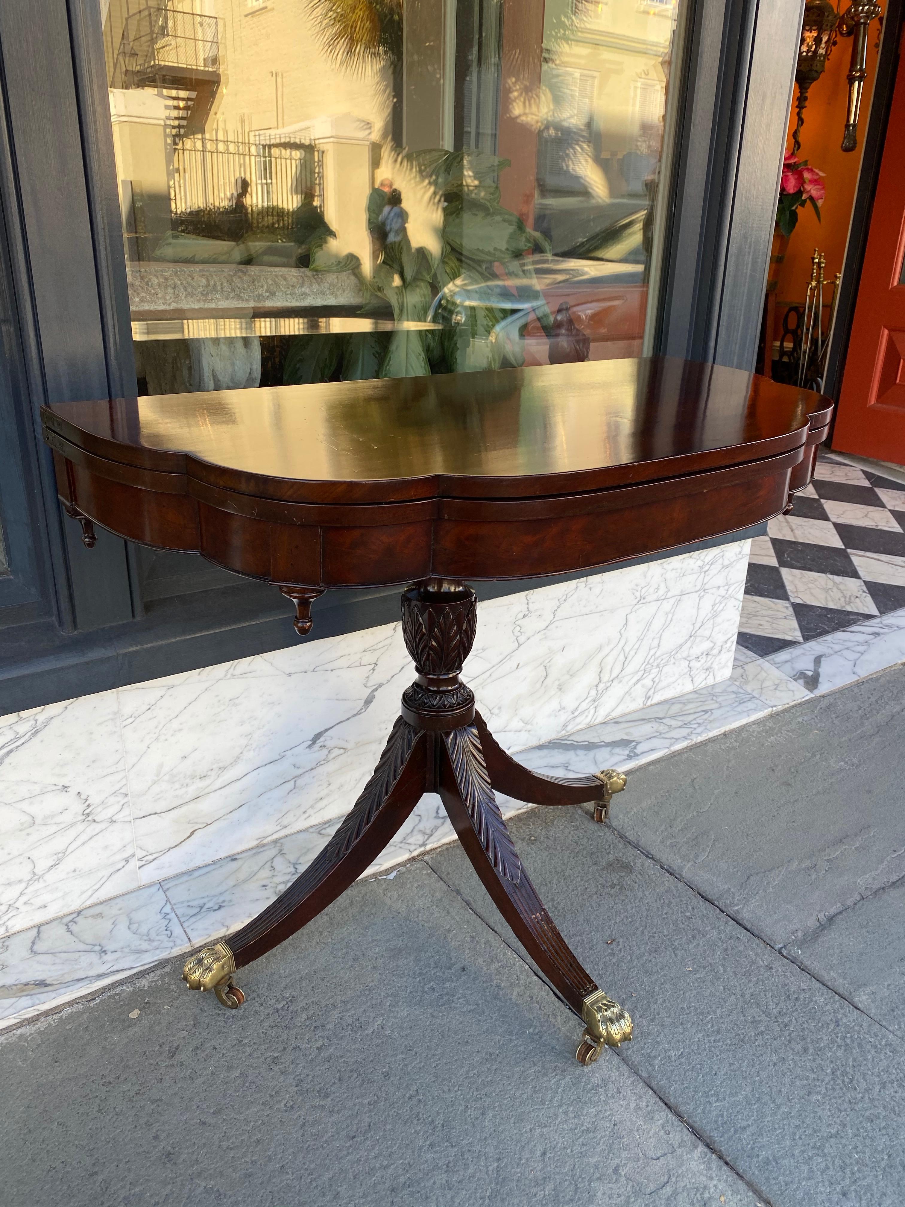 American trick leg card table with classically carved urn base, circa 1820, New York.