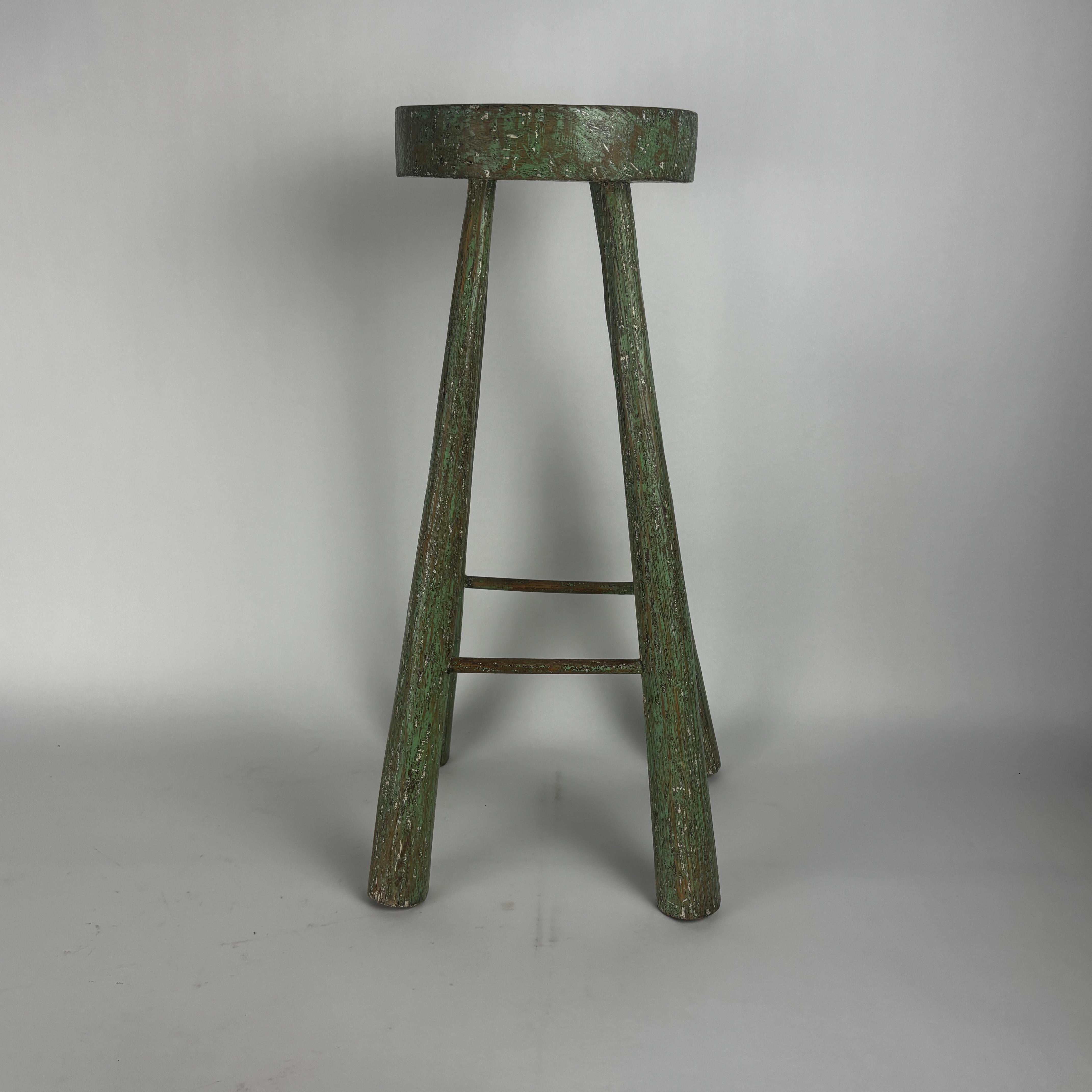 American vernacular sitting stool.

Hand hewn legs with dowel rung rest, paint is distressed.

Condition is as seen no issues of note and sturdy.

Prices on this platform are higher than our own due to the fees we pay for using it.