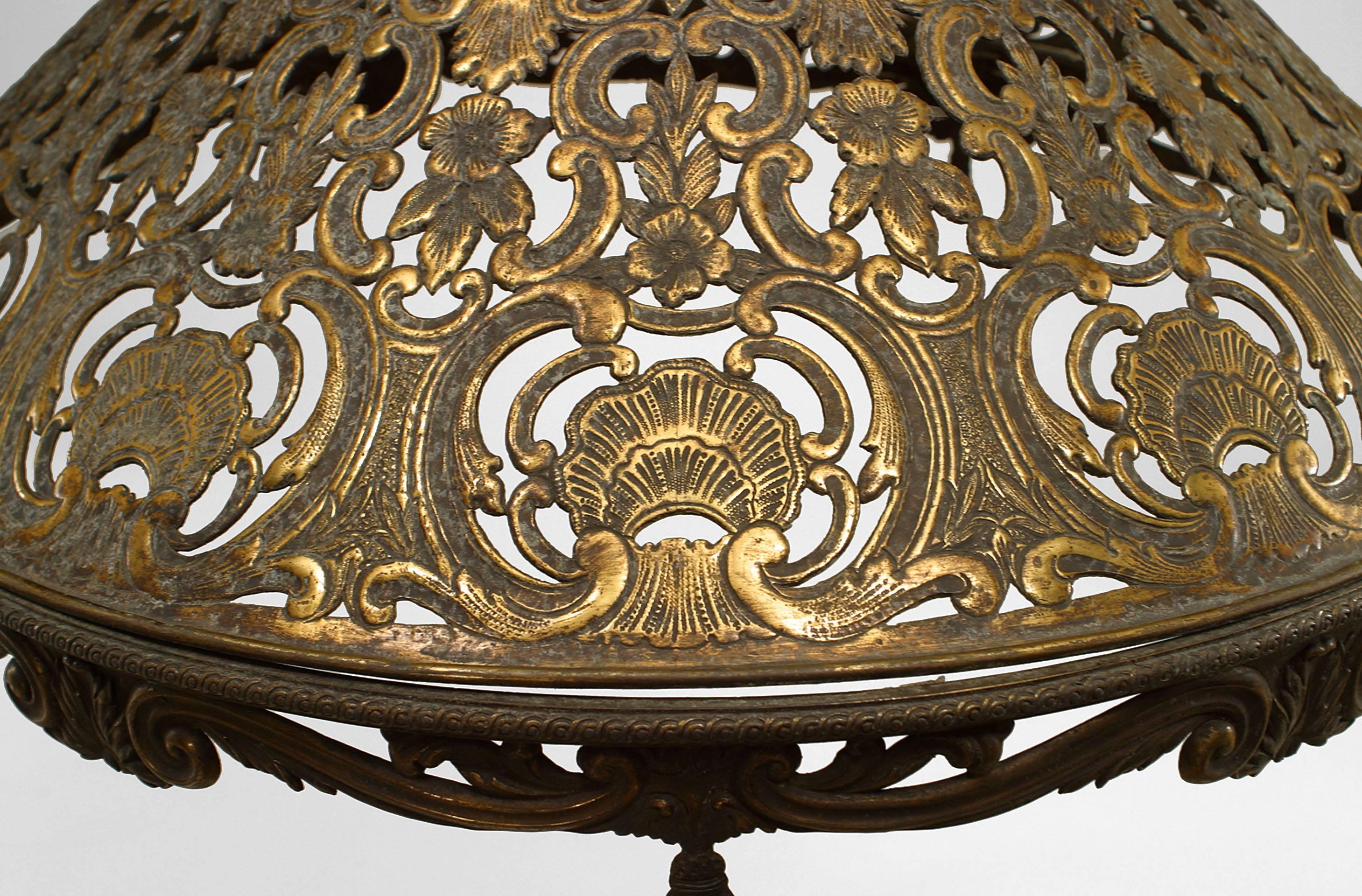 American Victorian brass filigree lamp shade with shell and floral design.
  