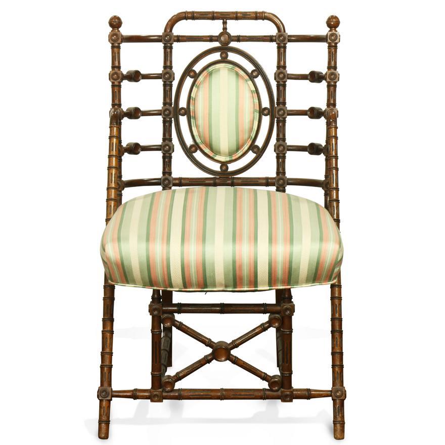 Antique Period American Victorian  walnut parlor chair by George Hunzinger, New York, circa 1869 executed in the Renaissance Revival taste, having a block and turned back and rising  on shaped legs, marked on rear leg, 