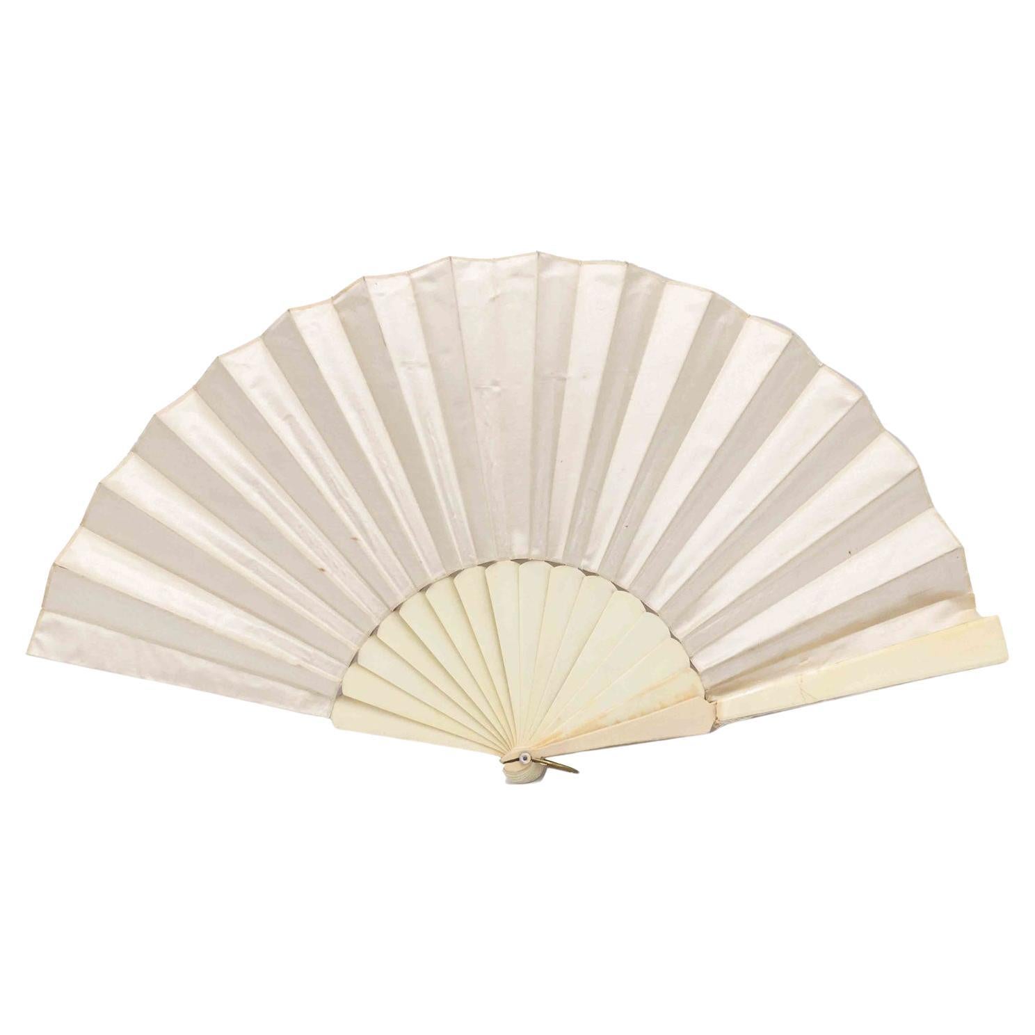 How do I identify an antique fan?