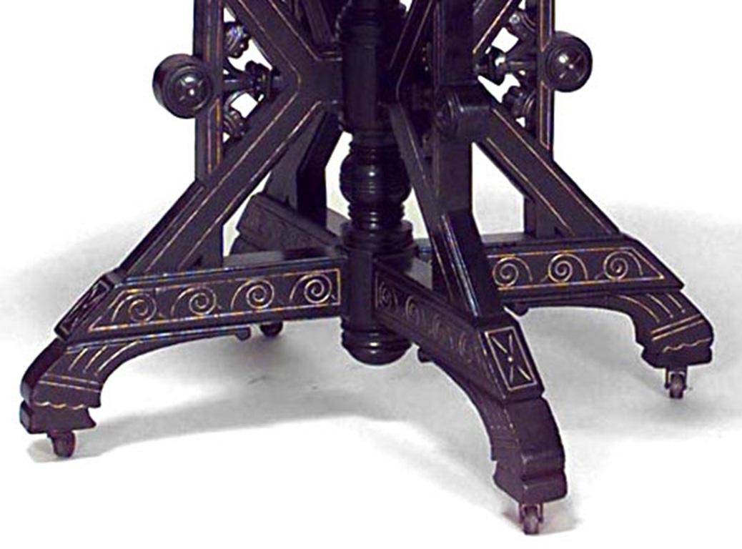 American Victorian Eastlake-style ebonized and gilt trimmed rectangular table with stretcher and white marble top.