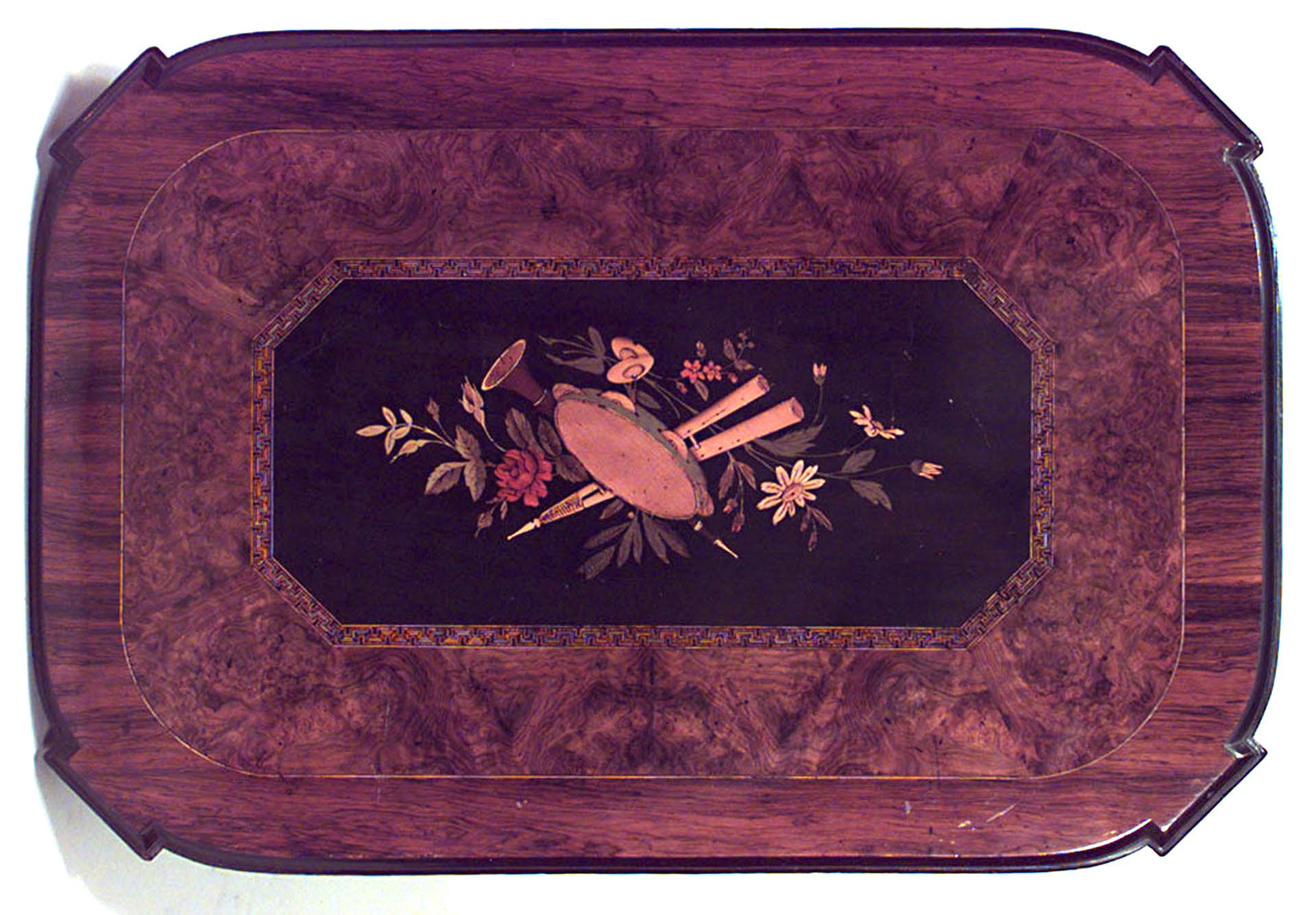 American Victorian (Eastlake style) rosewood rectangular table with a centered inlaid panel top supported on a black and gilt trimmed base with a stretcher.
