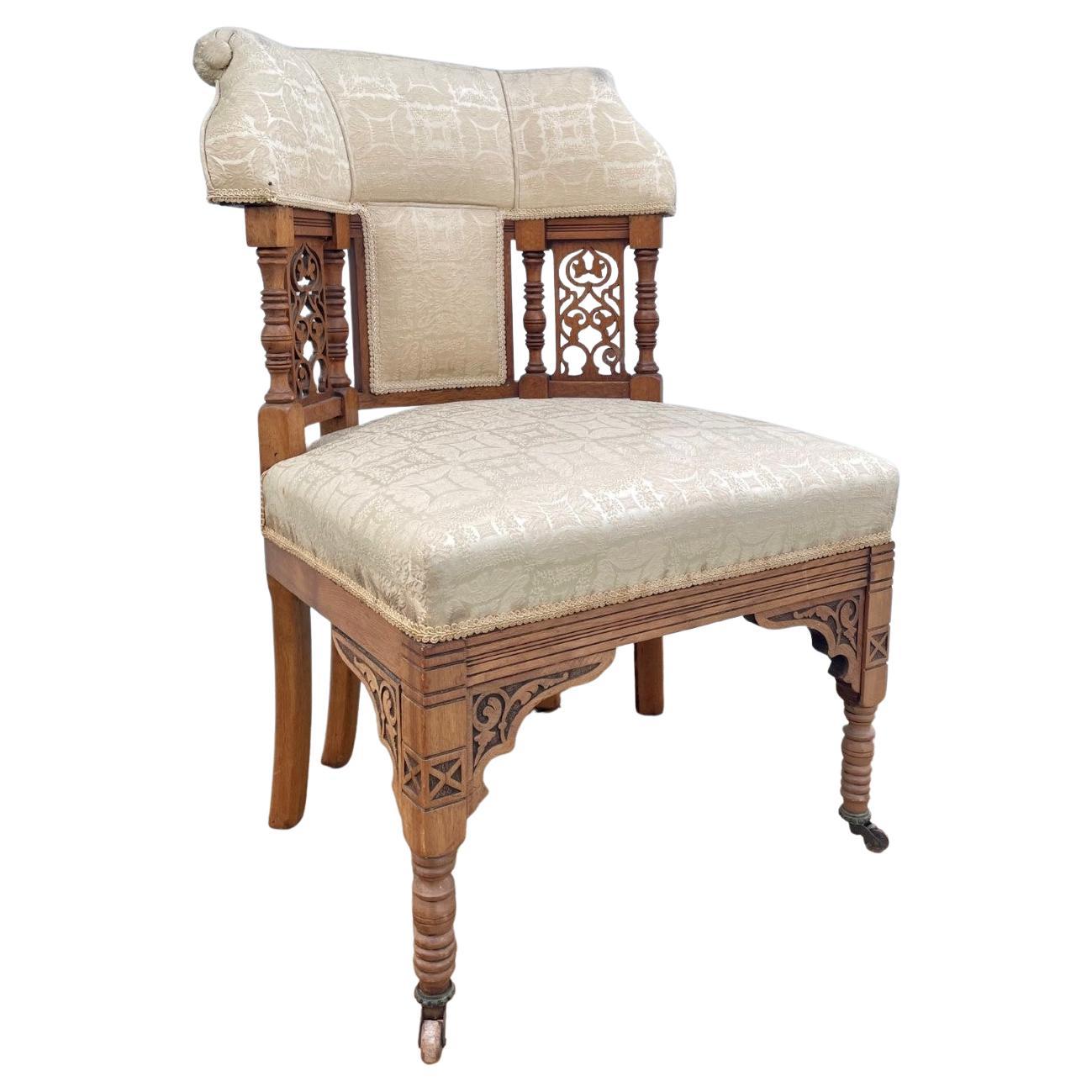 American Victorian Eastlake Upholstered chair 19th century.

Impressive carved and upholstered parlor chair, carved in openwork with two additional back legs set on brass casters. It was made in the midst of the Victorian Aesthetic Movement. The