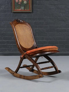 American Victorian Folding Cane Rocking Chair w/ Carved Rose Crest