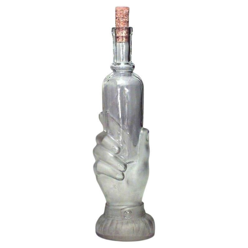 American Victorian glass decanter of hand holding small bottle For Sale