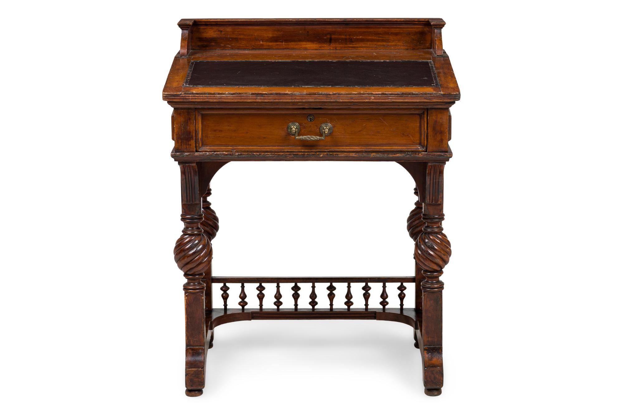 American Victorian mahogany slant front desk with gallery and turned legs and spindle design stretcher (signed HERTS BROTHERS, in drawer).
