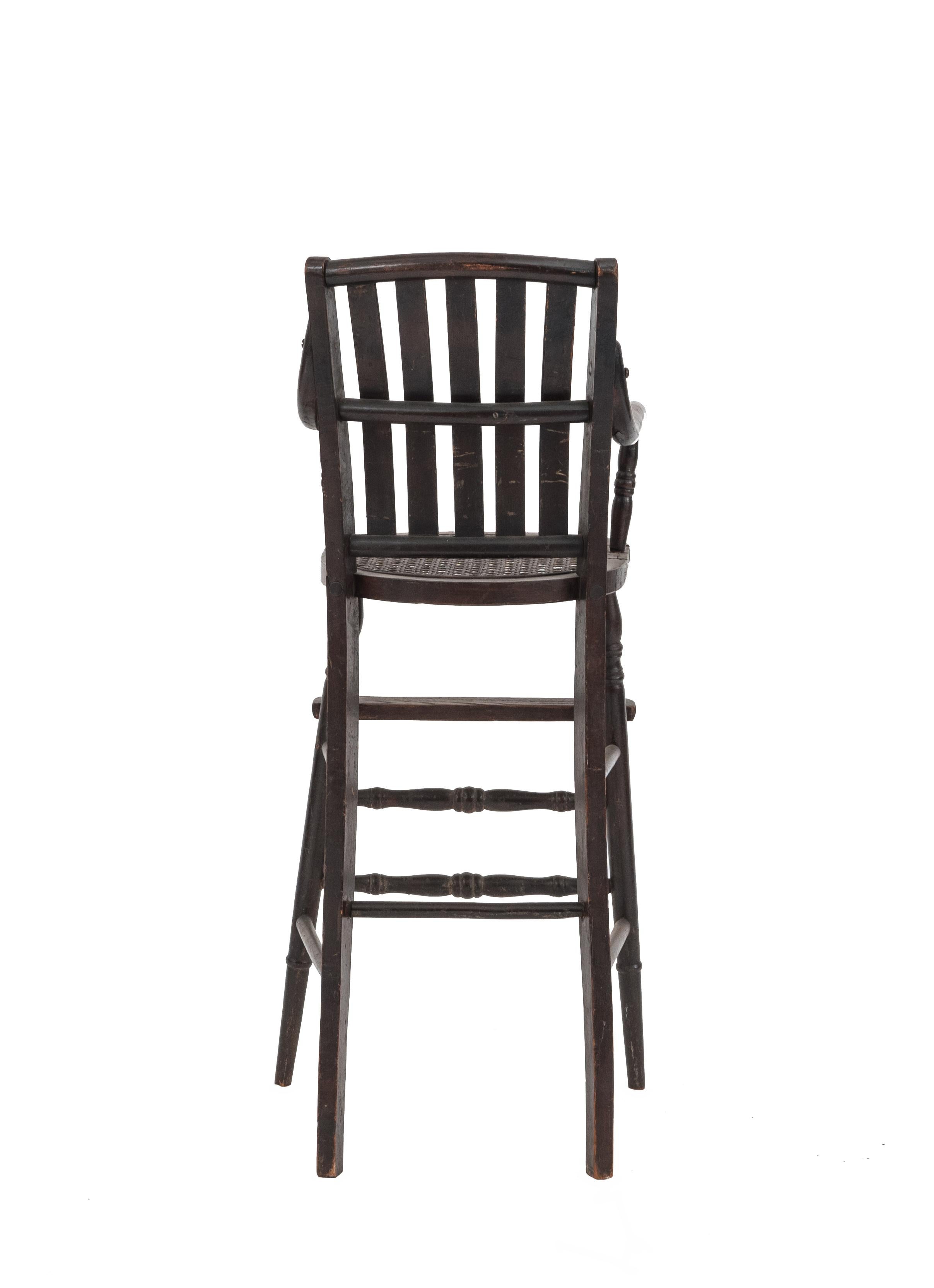 American Victorian child's high chair with slat back.