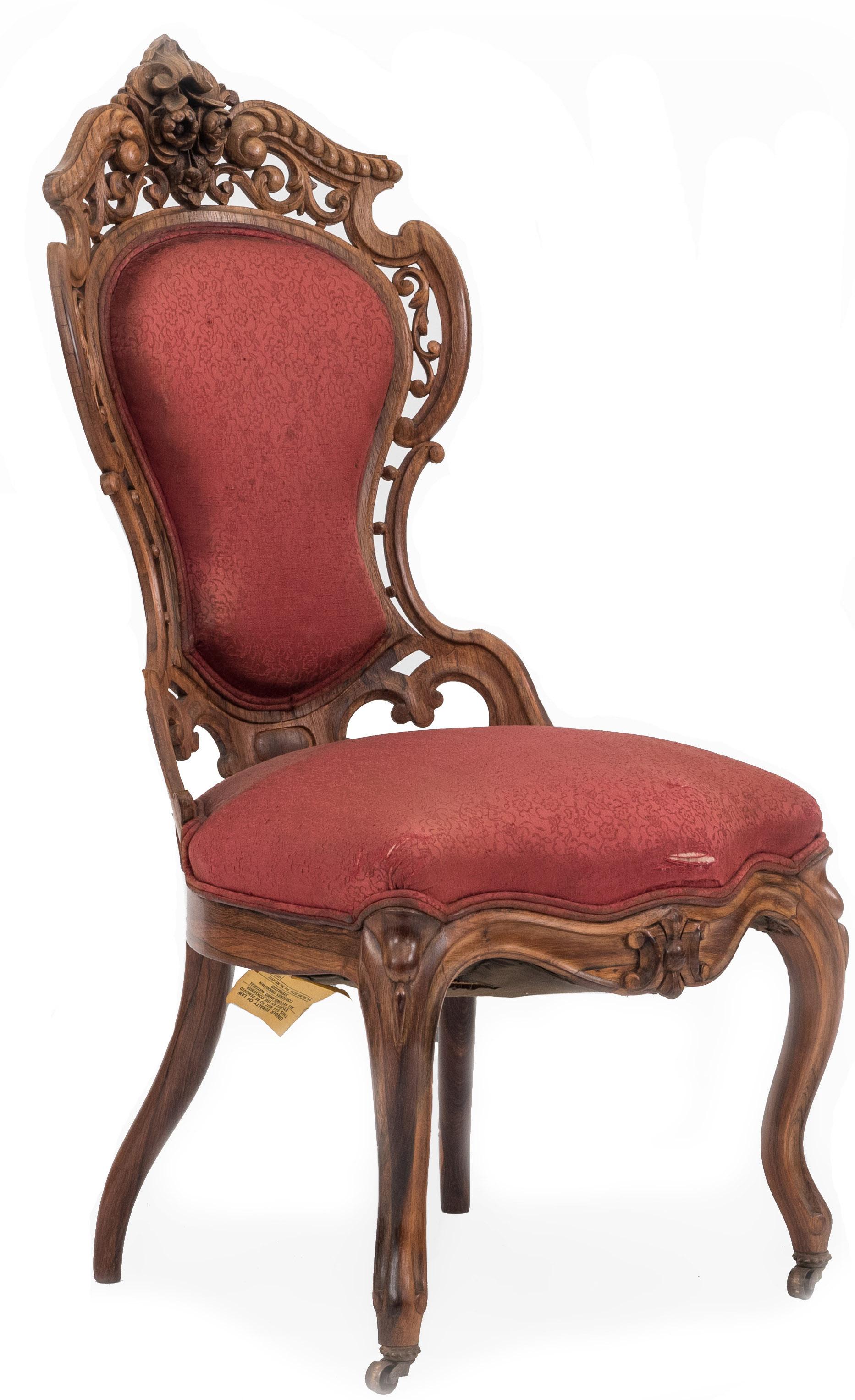 Pair of American Victorian rosewood and filigree carved back side chairs with red damask upholstery. (att: Meeks)
