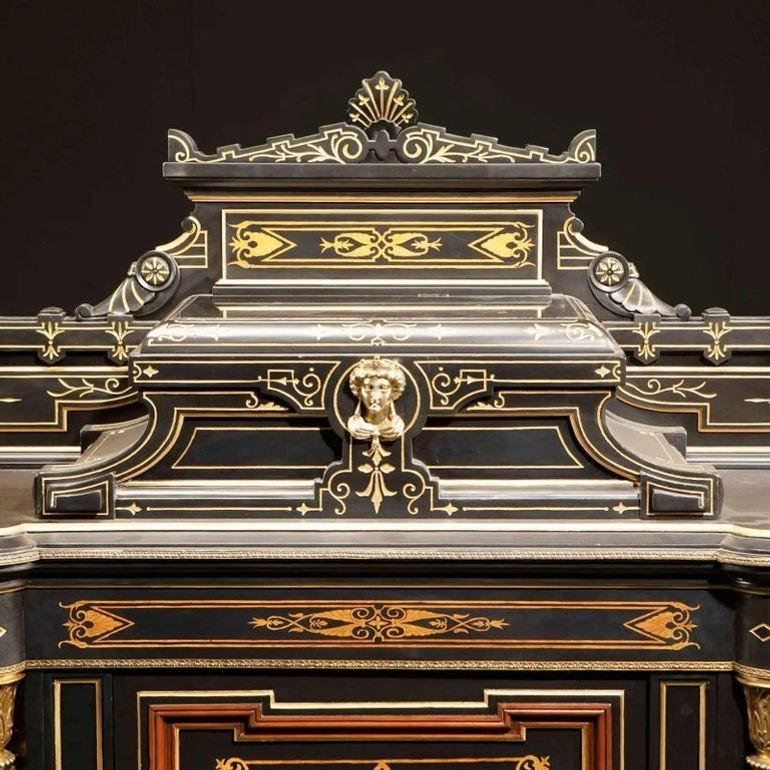 American victorian renaissance revival cabinet with over the top inlaid, Late 19th century

Ebonized walnut with marquetry inlay, gold enamel highlighted features, and patinated bronze mounts

Dimensions:

62