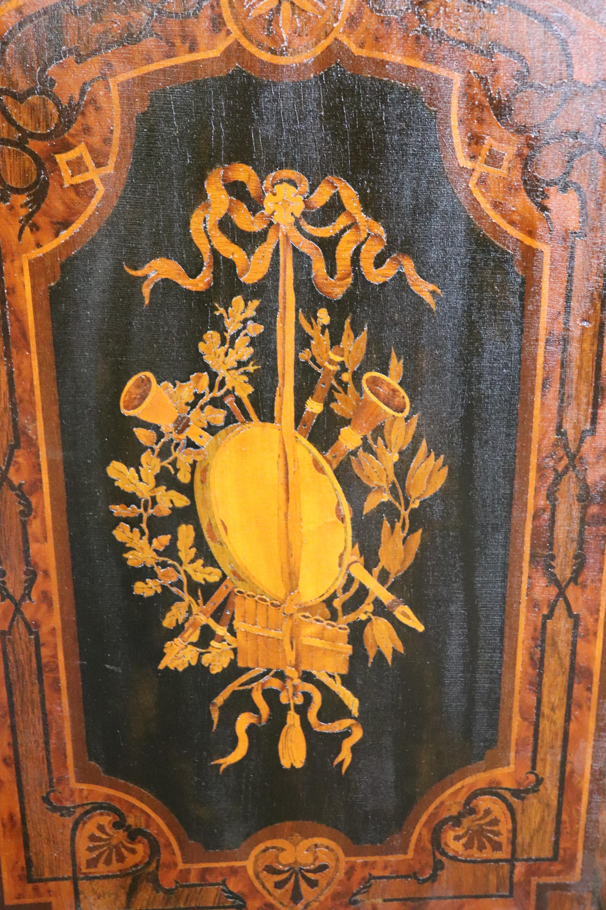 This is a gorgeous sideboard with a trophy top and incredible bronze ormolu and inlaid musical instruments. The piece is American and in the style of Herter brothers or Pottier and Stymus. The piece is in original condition but will show minimal