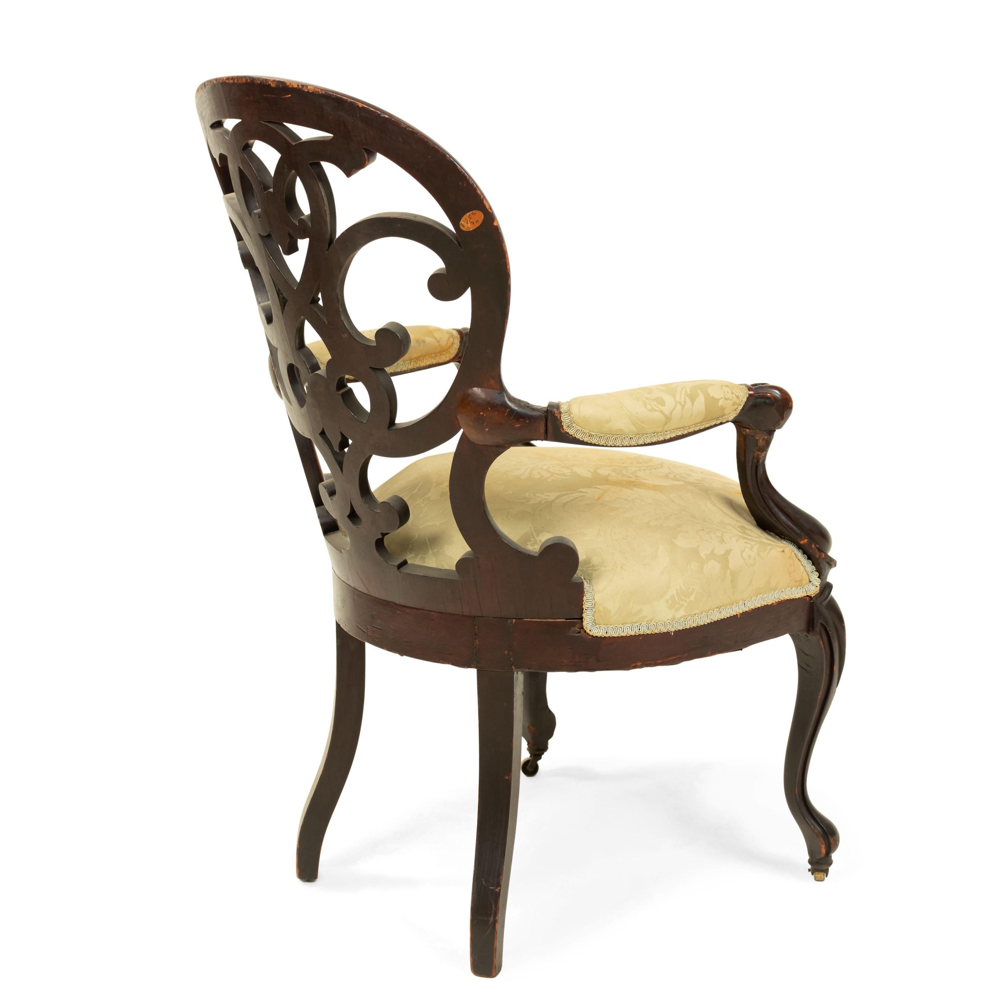 Amerikanischer viktorianischer Sessel aus laminiertem Palisanderholz mit offener Rückenlehne, Scroll-Design und hellgrün gepolstertem Sitzkissen und Armlehnen.
