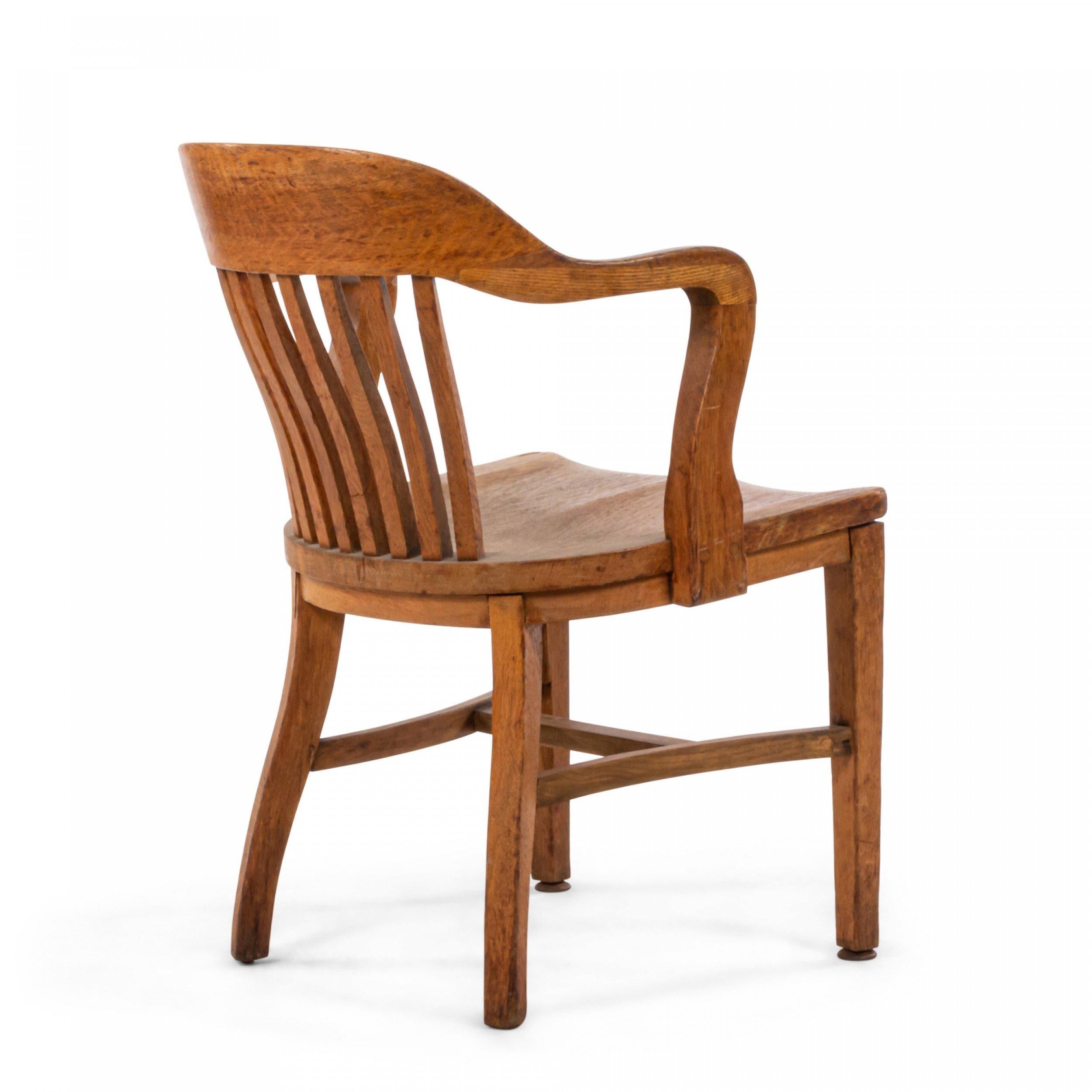 American Victorian-style (19th/20th Century) oak slat back arm chair..
 