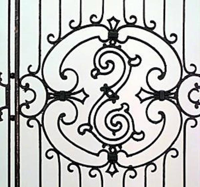 19 American Victorian style (19/20th Century) iron gates with filigree multi-scroll design and lattice base (PRICED EACH) (Related item: 030000).
