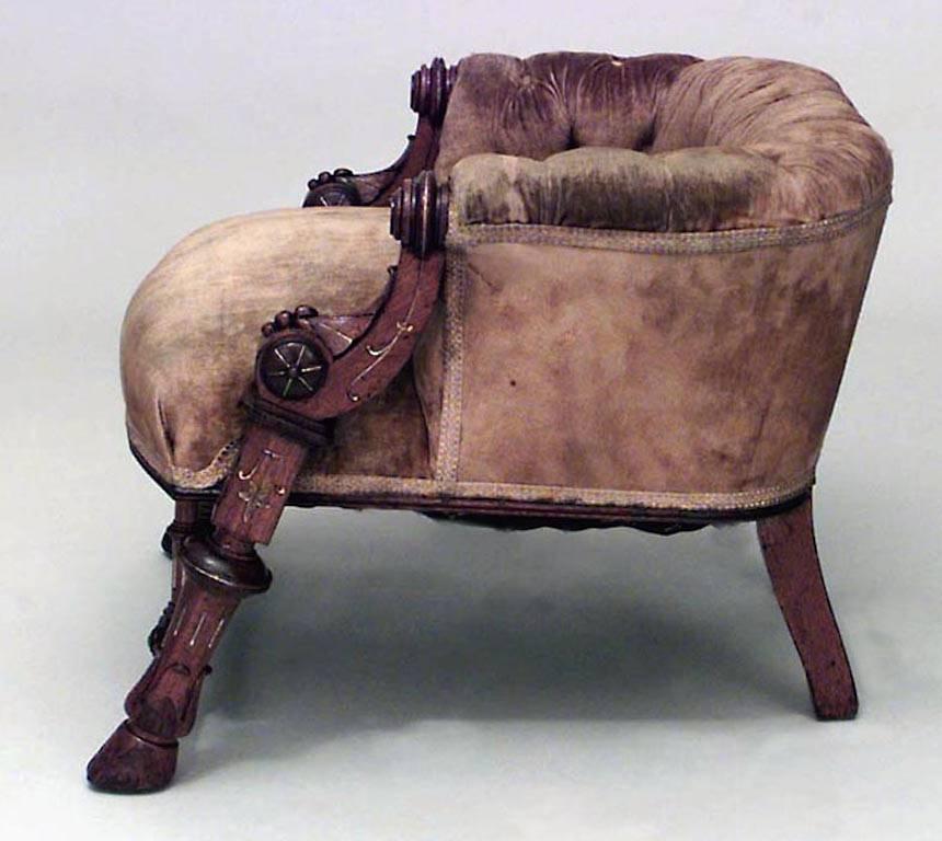 American Victorian walnut and gold incised trimmed low back armchair with tufted gold upholstery (signed HUNZINGER 1869).
 