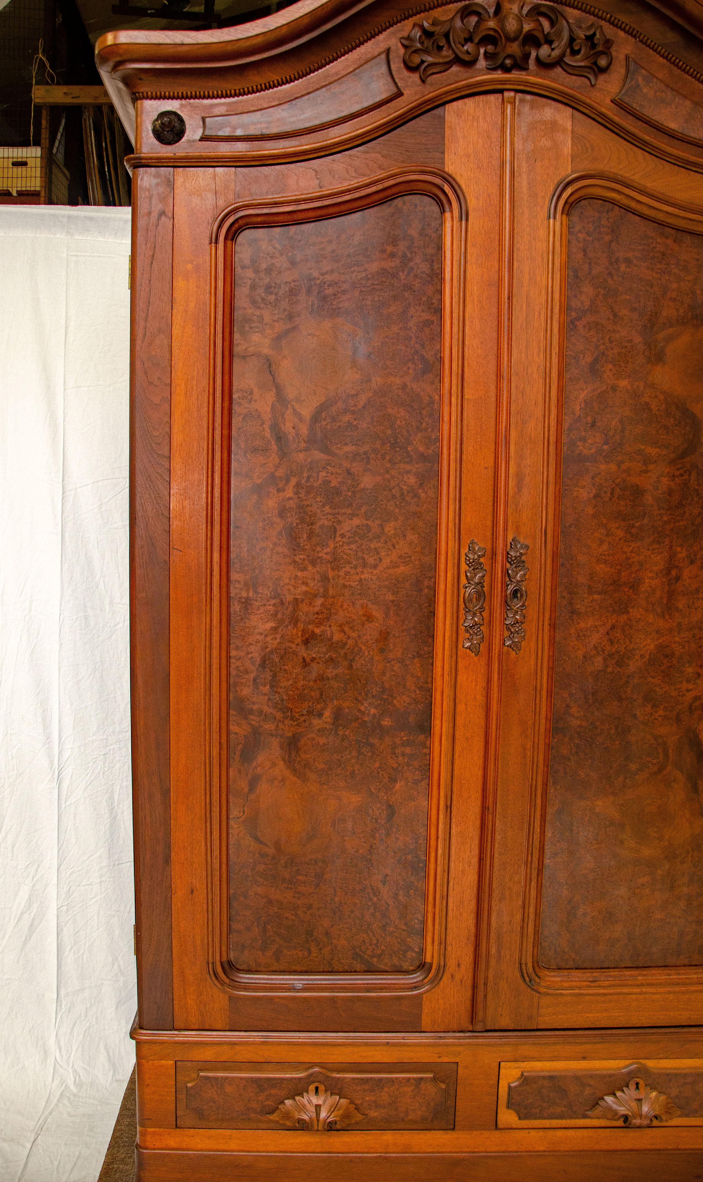 A very nice Victorian walnut armoire that requires a tall ceiling to accommodate at 98