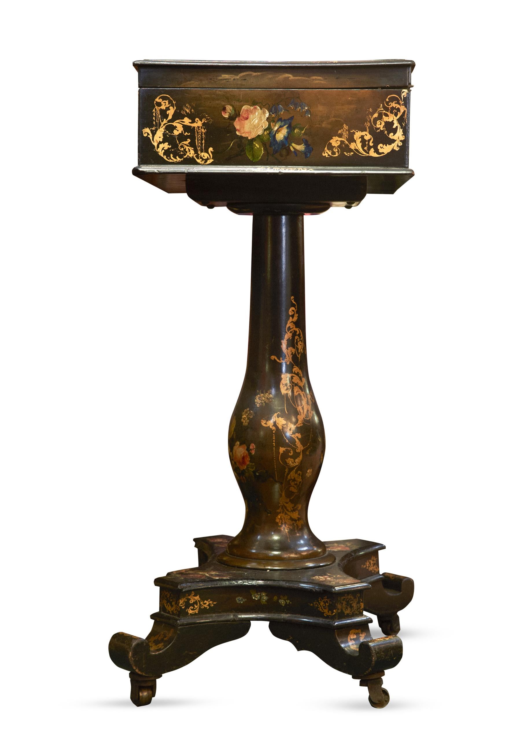 American Victorian Wood and Paper Mache sewing box on pedestal base
Paper Mache depicts bird and flower motif. Original red velvet lines the inner boxes which have a place for all of your sewing notions.
America, circa 1840
Measures: 75