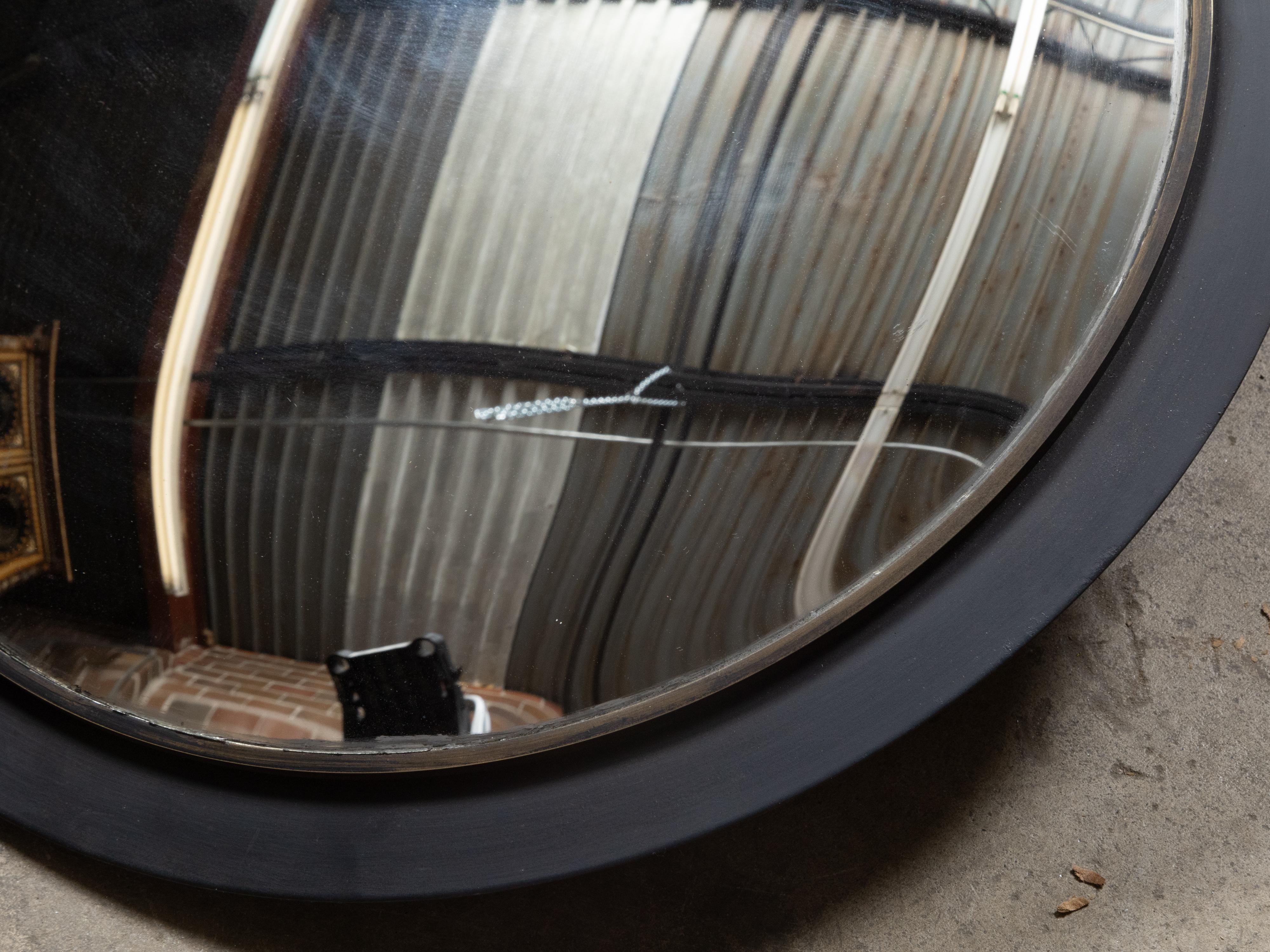 Peint Miroir convexe américain vintage avec cadre circulaire en métal noir en vente