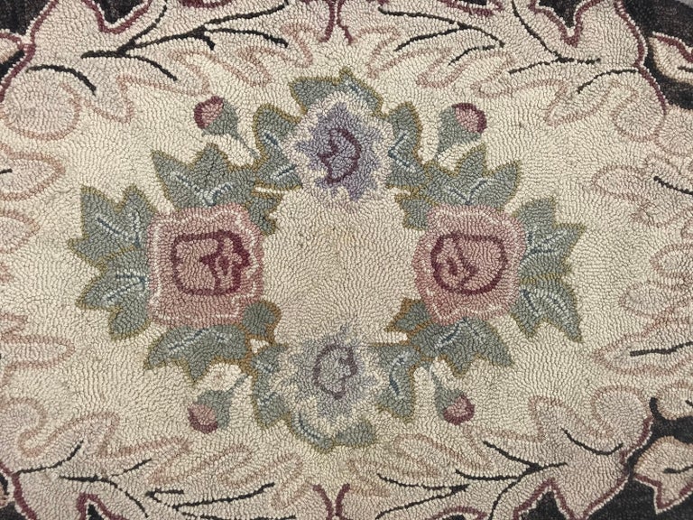 Beautiful American Hook rug, with a decorative floral design, entirely American needlework made with wool velvet on cotton foundations.