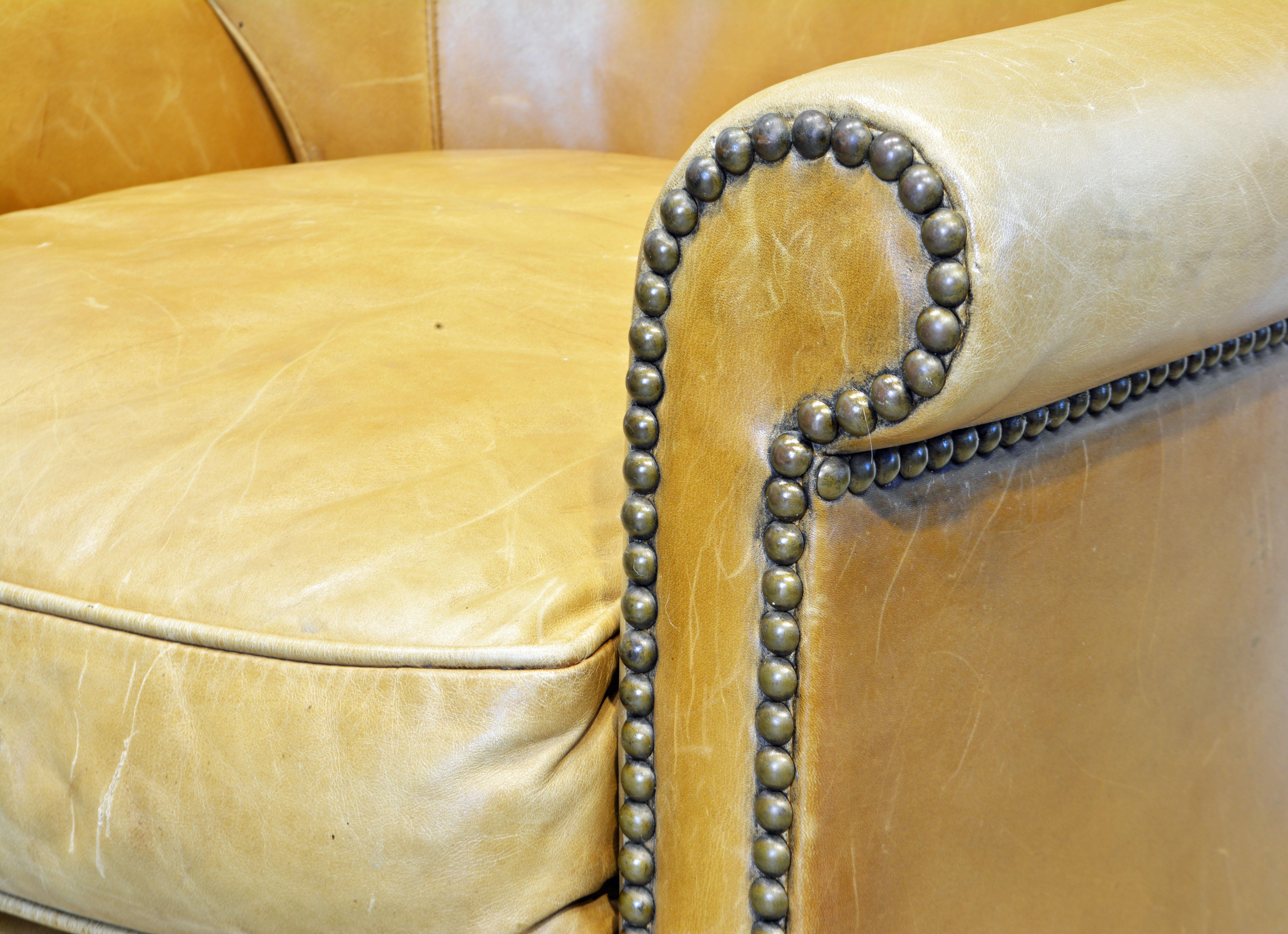 American Vintage Leather Covered and Nail Head Trimmed Wing Back Chair, 20th C. 1