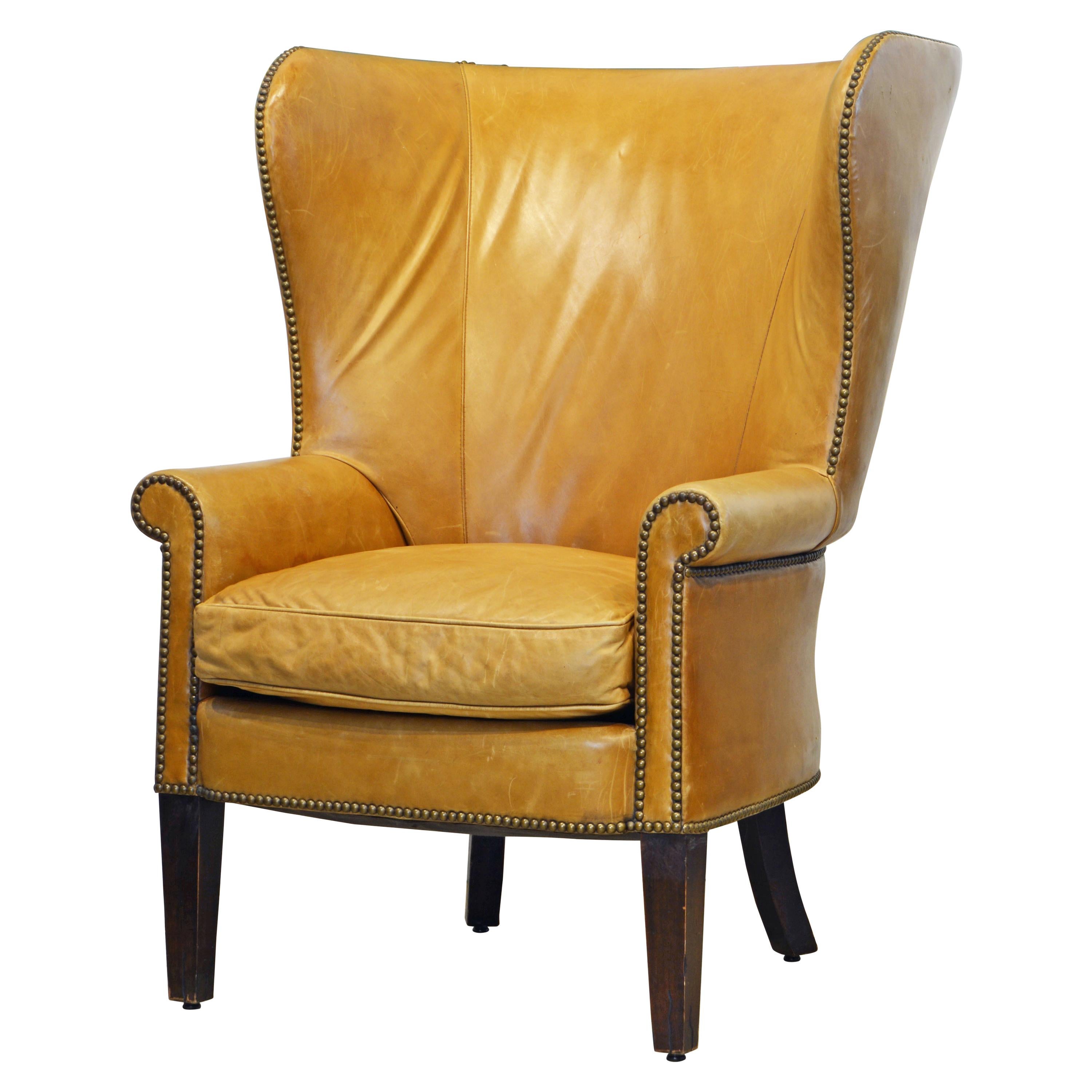 American Vintage Leather Covered and Nail Head Trimmed Wing Back Chair, 20th C.