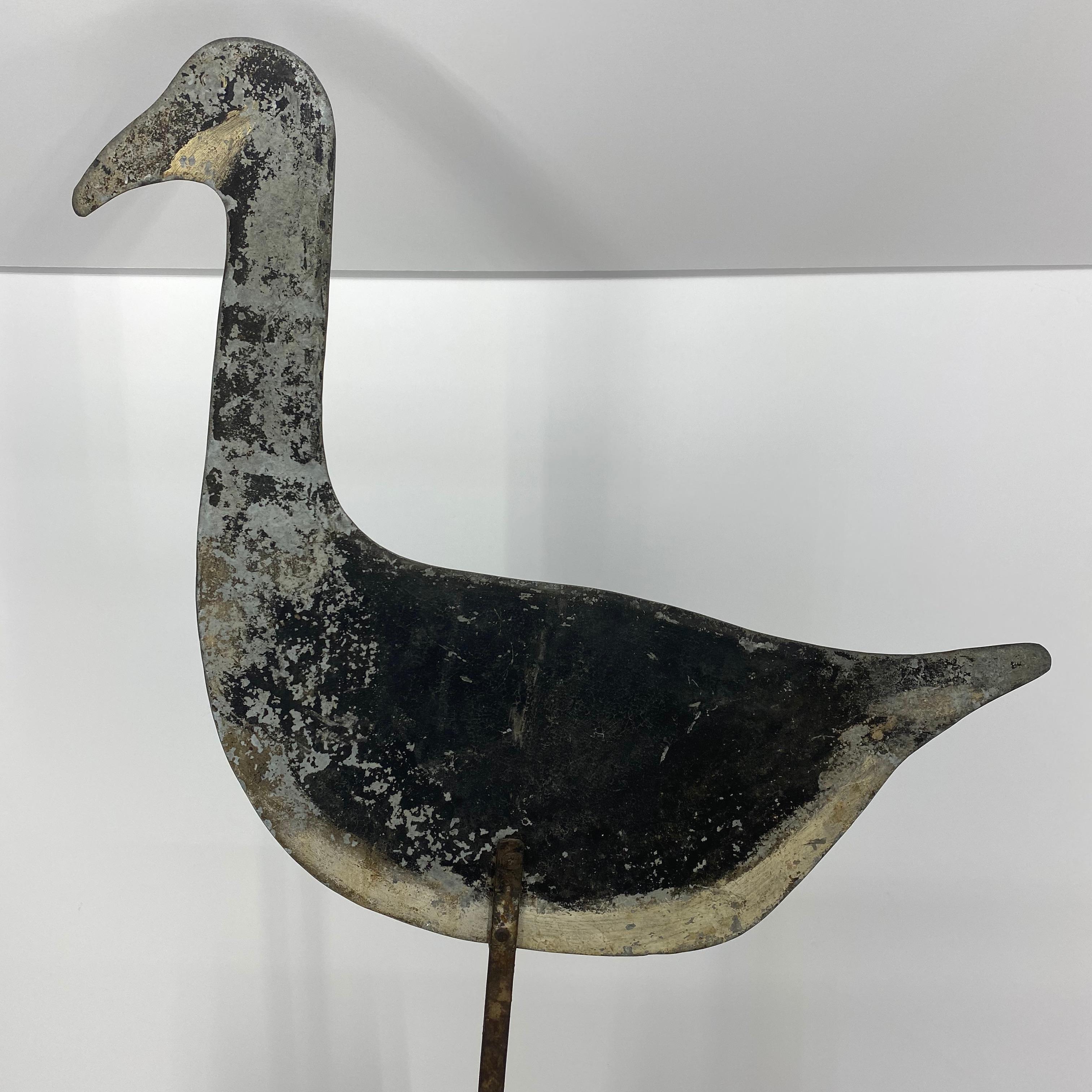 Painted toleware metal goose decoy table sculpture, America, 1930s

The metal decoy is seated in basic custom made oval wooden base.