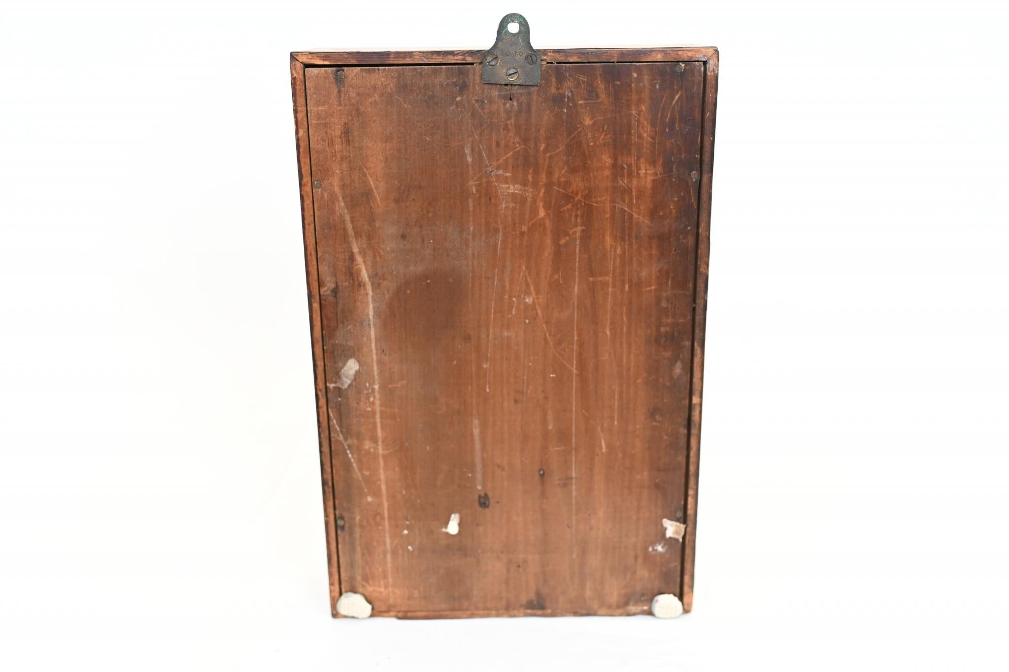 Wonderful 8 day American wall clock in a mahogany case
Features a hand painted floral spray panel below the clock face
Features a double barrel movement and comes with a key
Offered in great shape ready for home use right away
We ship to every